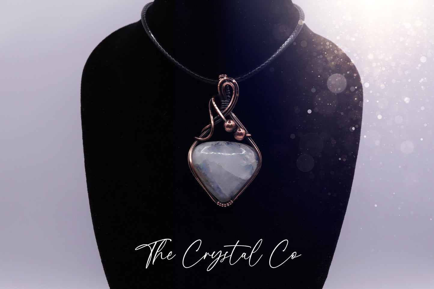 Beautiful flashy rainbow moonstone pendant, wire wrapped in antiqued copper wire Beautiful flashes of blue, greens and yellows Comes with a black cord chain. Ideal for individuals who love crystals and jewellery. Rainbow moonstone is also the birthstone for June making this an ideal gift for birthdays.
