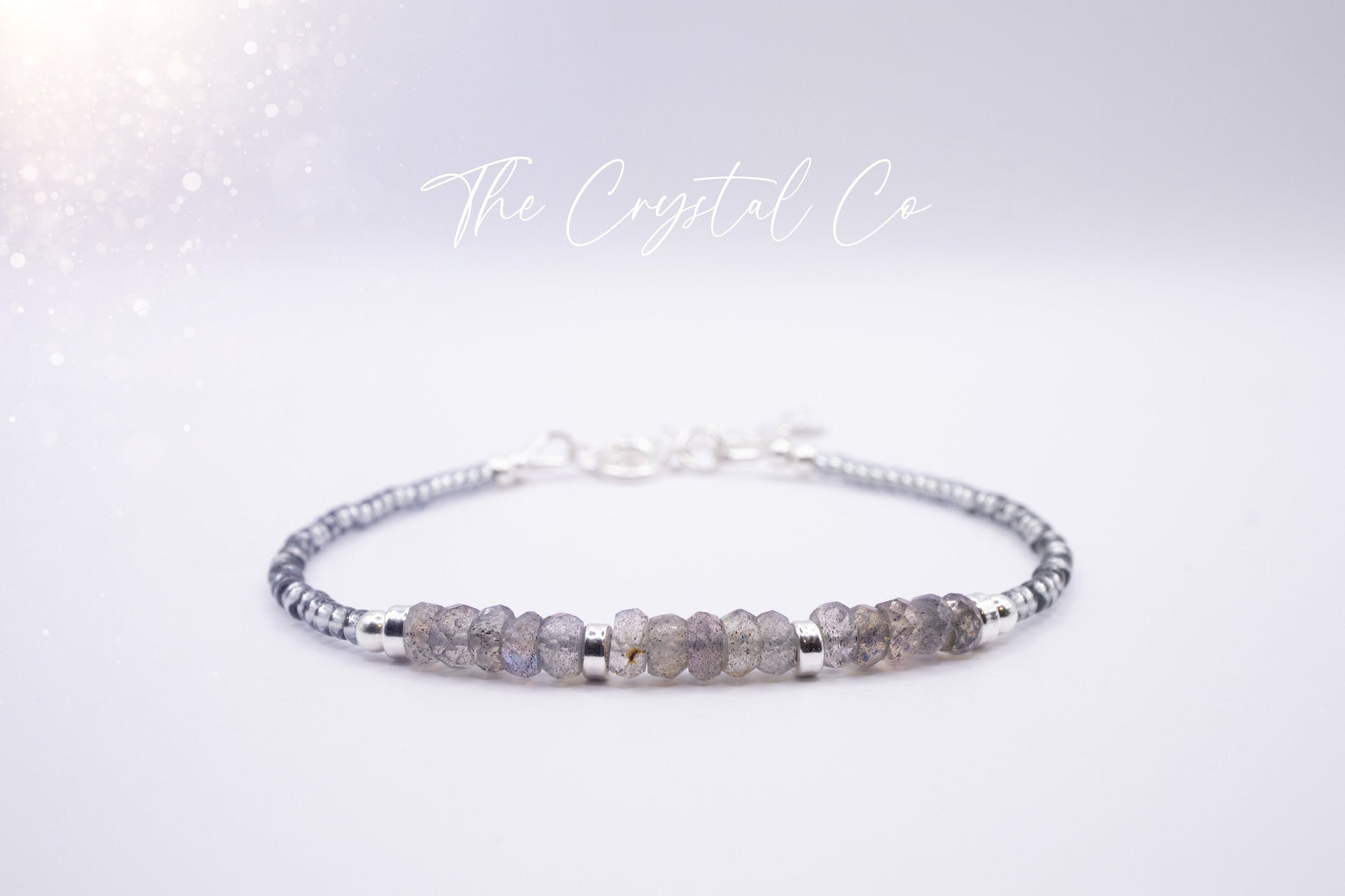 Dainty labradorite crystal beaded bracelet featuring iridescent flashes of blue and green. Handcrafted with delicate beads for a lightweight, elegant design. Perfect for layering or wearing alone. Ideal for gifting or adding sparkle to any outfit