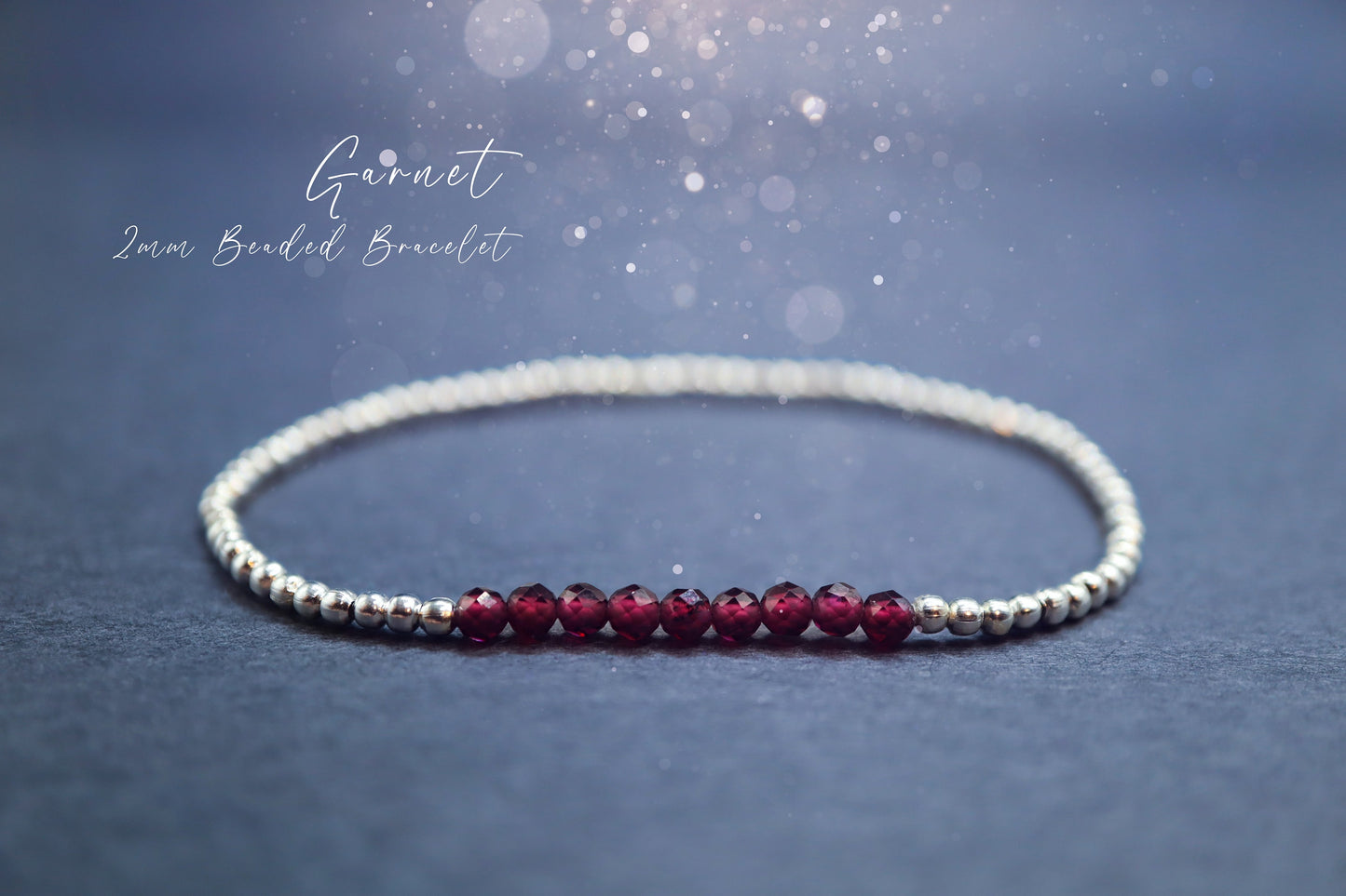 Beautiful and handmade, little crystal garnet stacking bracelet. Featuring faceted natural garnet crystal beads, strung onto elastic with silver plated bead. Garnet is the birthstone for January. Complete with properties card. Ideal crystal gifts.