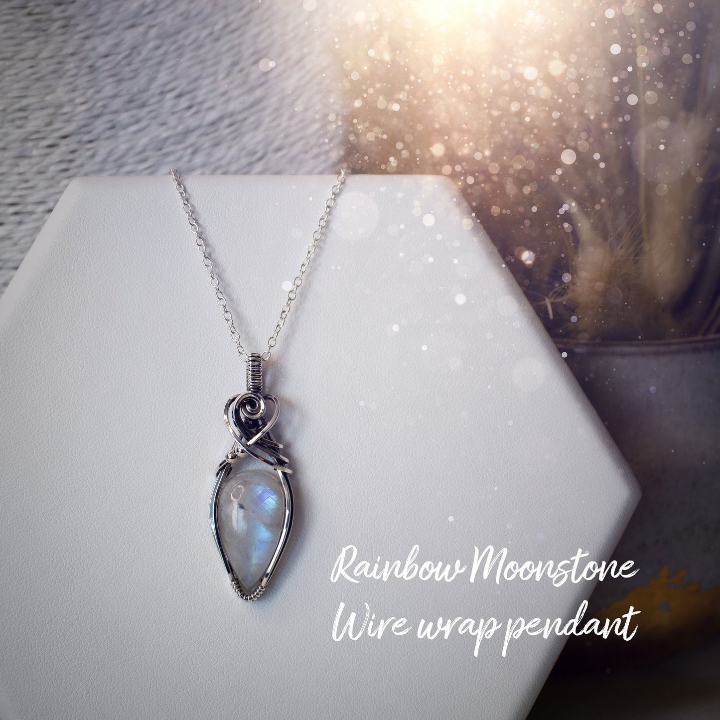 Beautifully handmade, rainbow moonstone wire wrapped pendant necklace. This pendant features a very flashy moonstone crystal which has been wrapped in sterling silver wire and antiqued to bring out the flash. Ideal gift for crystal lovers. Bohemian