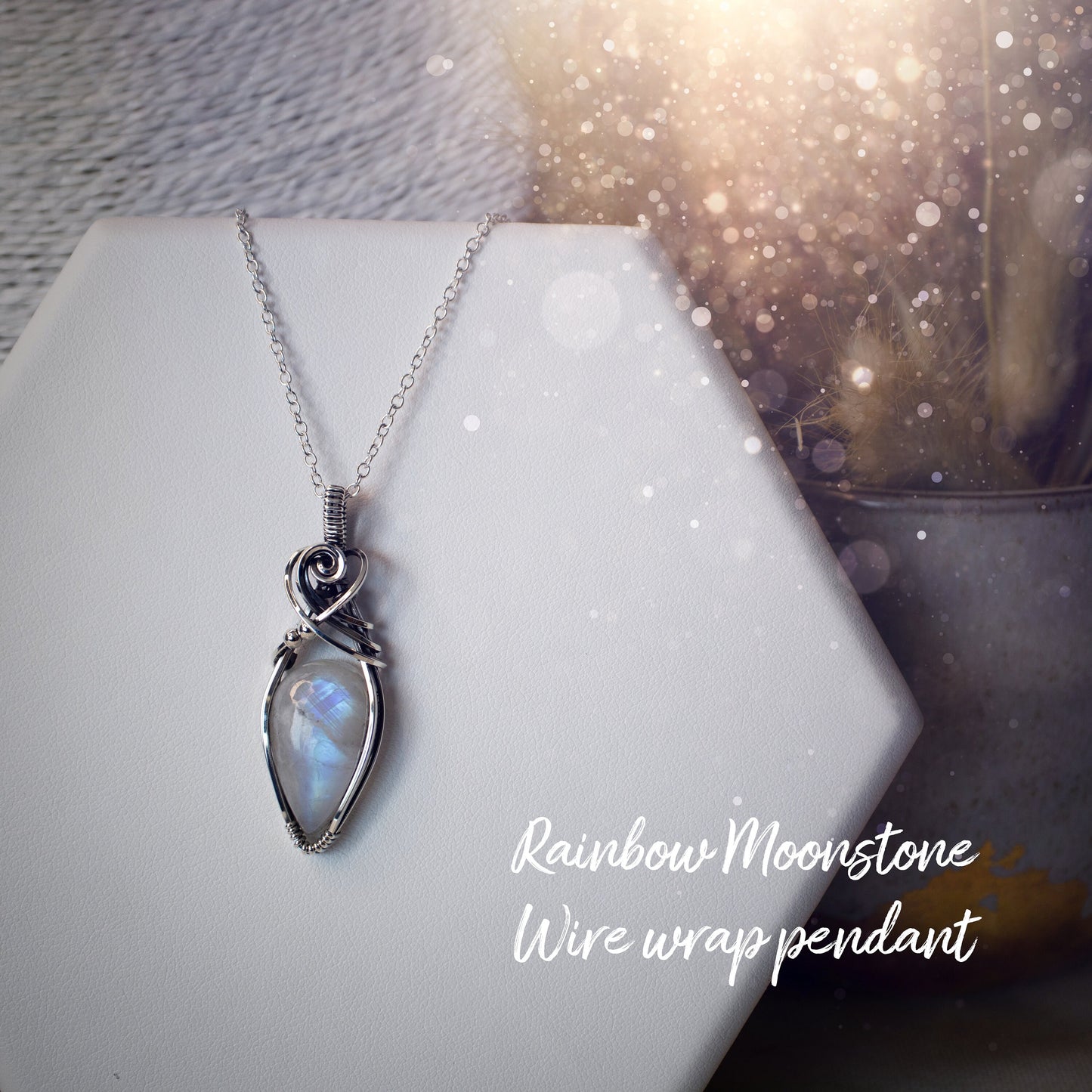 Beautifully handmade, rainbow moonstone wire wrapped pendant necklace. This pendant features a very flashy moonstone crystal which has been wrapped in sterling silver wire and antiqued to bring out the flash. Ideal gift for crystal lovers. Bohemian
