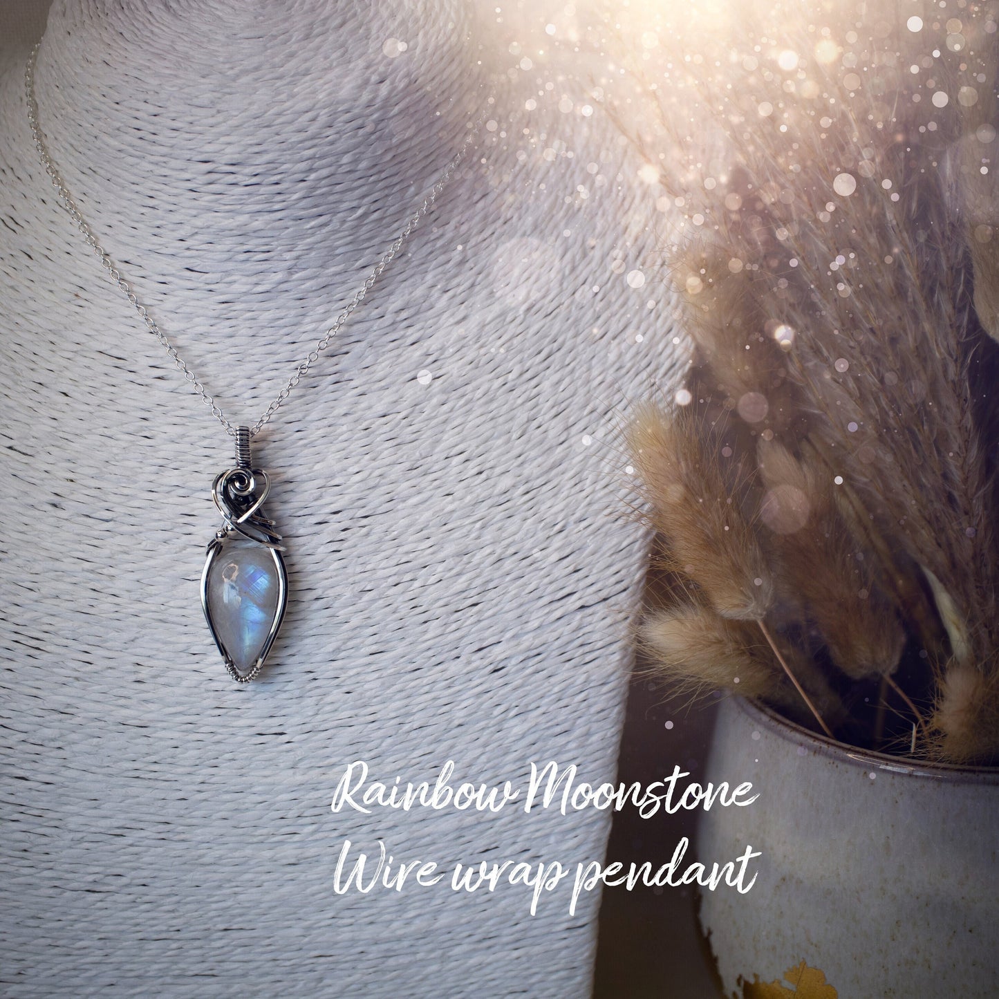 Beautifully handmade, rainbow moonstone wire wrapped pendant necklace. This pendant features a very flashy moonstone crystal which has been wrapped in sterling silver wire and antiqued to bring out the flash. Ideal gift for crystal lovers. Bohemian