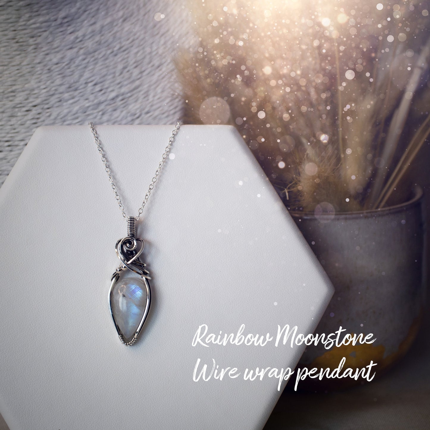 Beautifully handmade, rainbow moonstone wire wrapped pendant necklace. This pendant features a very flashy moonstone crystal which has been wrapped in sterling silver wire and antiqued to bring out the flash. Ideal gift for crystal lovers. Bohemian