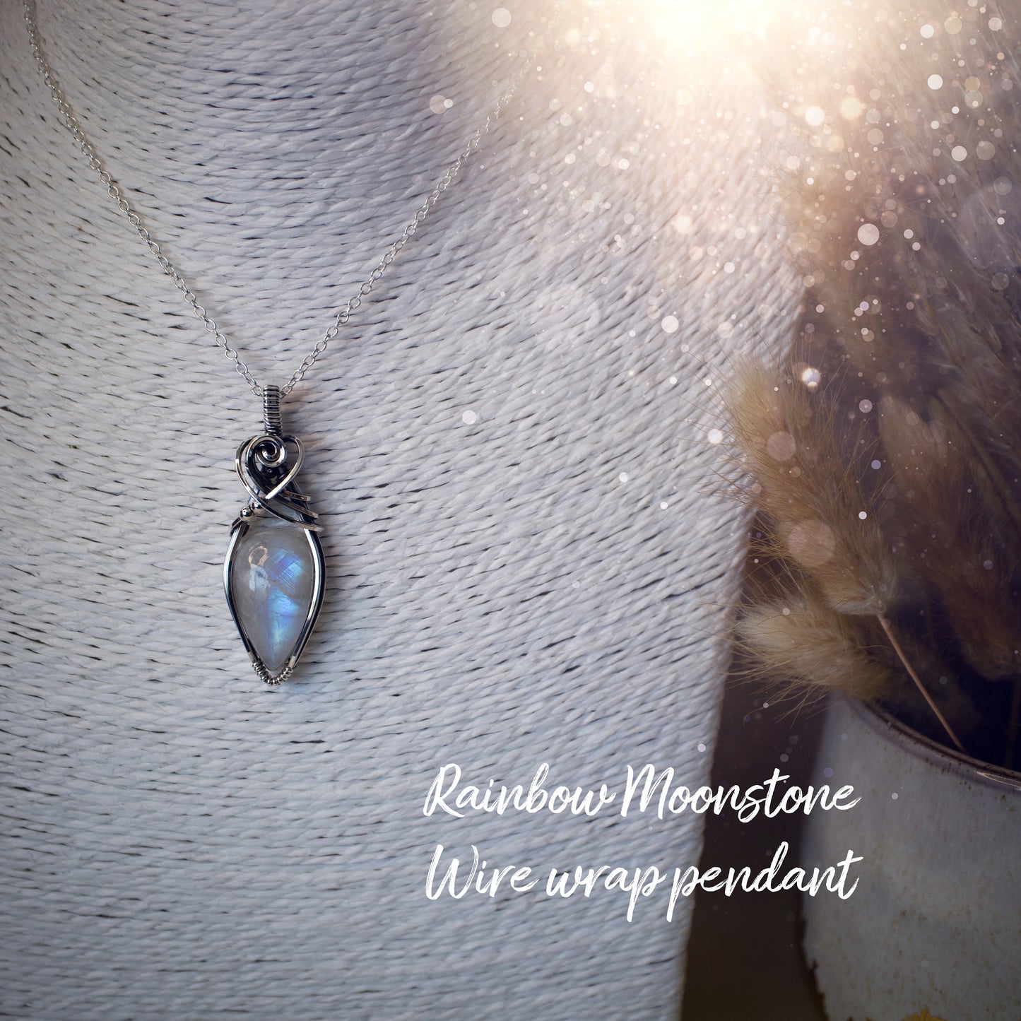 Beautifully handmade, rainbow moonstone wire wrapped pendant necklace. This pendant features a very flashy moonstone crystal which has been wrapped in sterling silver wire and antiqued to bring out the flash. Ideal gift for crystal lovers. Bohemian