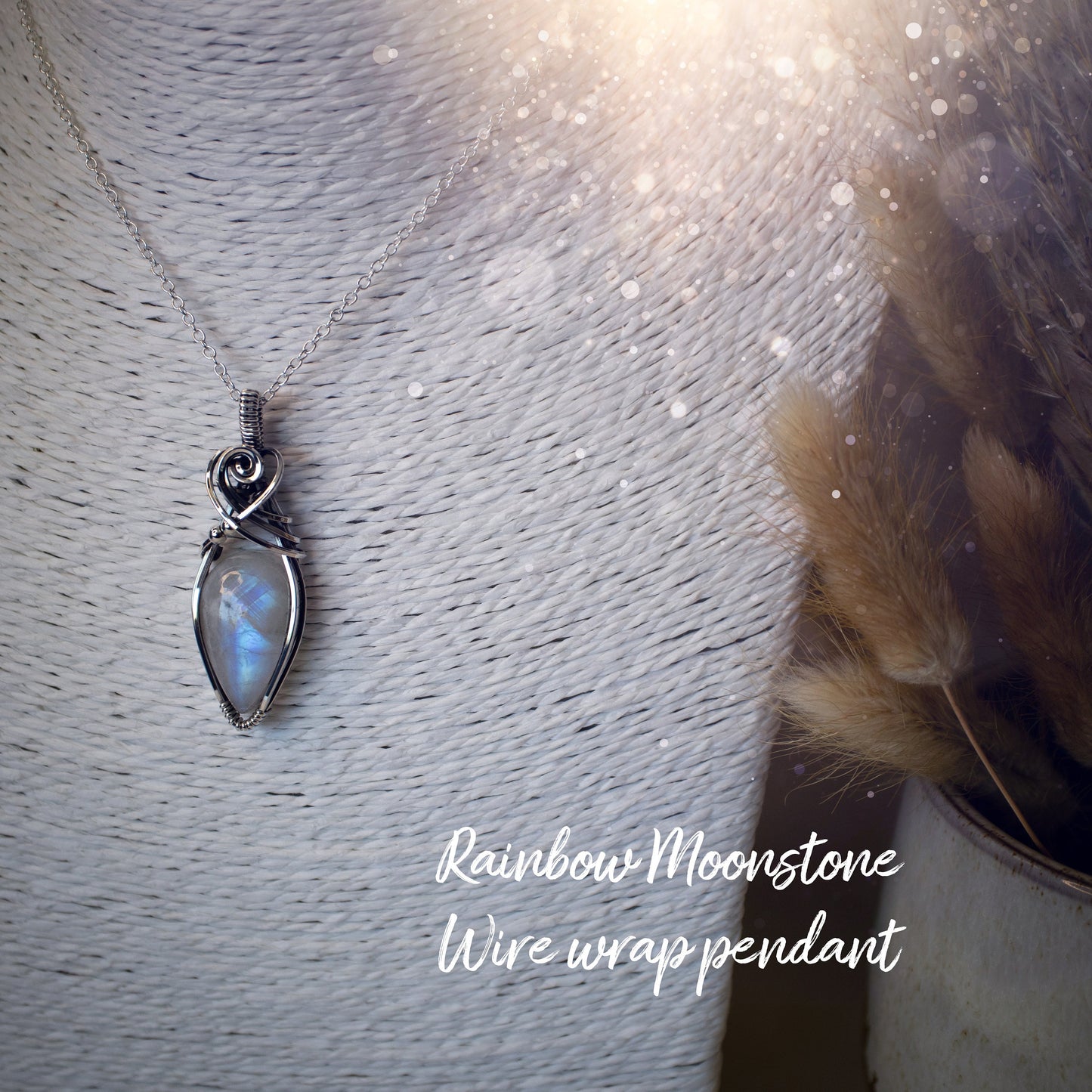 Beautifully handmade, rainbow moonstone wire wrapped pendant necklace. This pendant features a very flashy moonstone crystal which has been wrapped in sterling silver wire and antiqued to bring out the flash. Ideal gift for crystal lovers. Bohemian