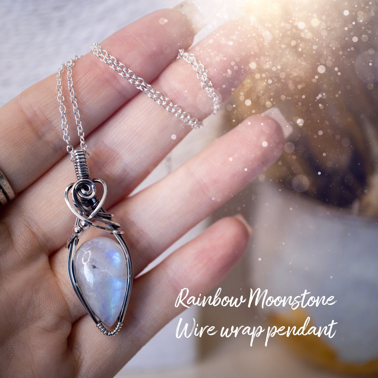 Beautifully handmade, rainbow moonstone wire wrapped pendant necklace. This pendant features a very flashy moonstone crystal which has been wrapped in sterling silver wire and antiqued to bring out the flash. Ideal gift for crystal lovers. Bohemian