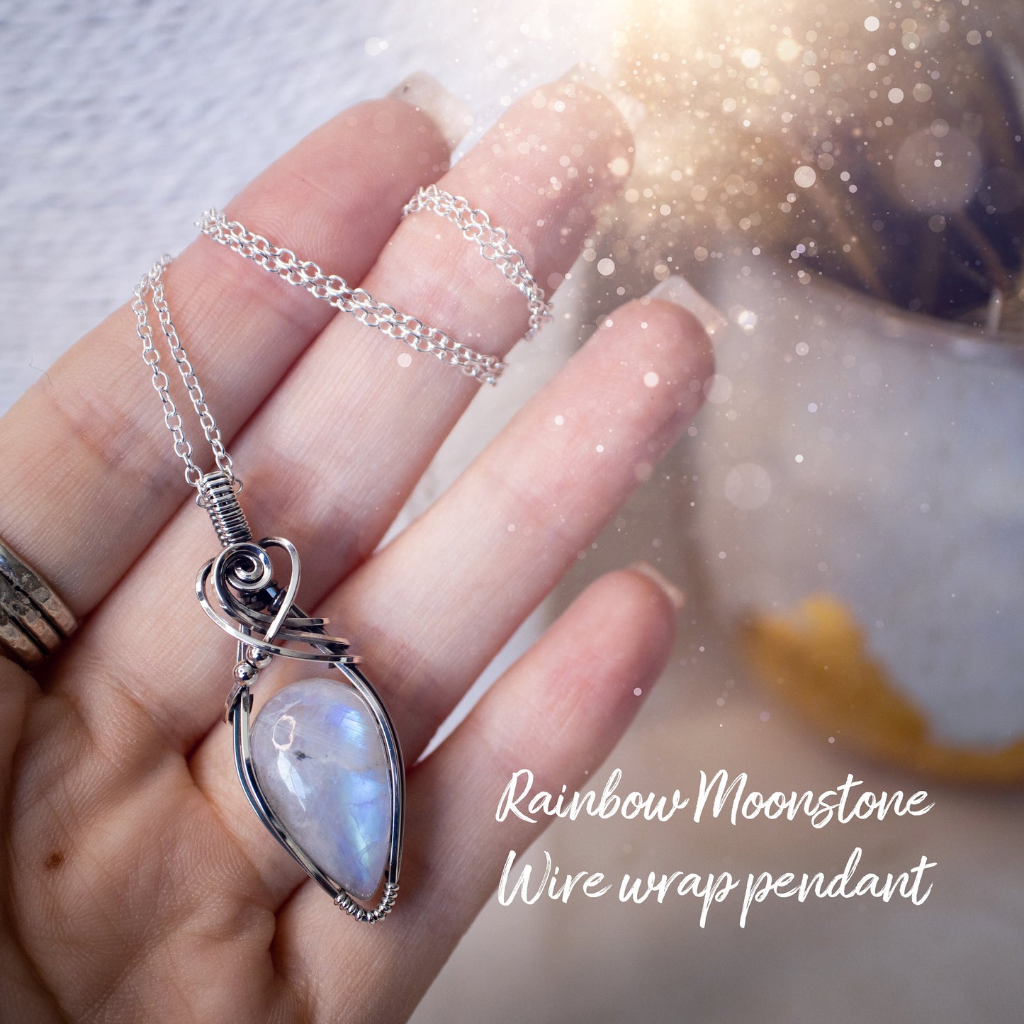 Beautifully handmade, rainbow moonstone wire wrapped pendant necklace. This pendant features a very flashy moonstone crystal which has been wrapped in sterling silver wire and antiqued to bring out the flash. Ideal gift for crystal lovers. Bohemian