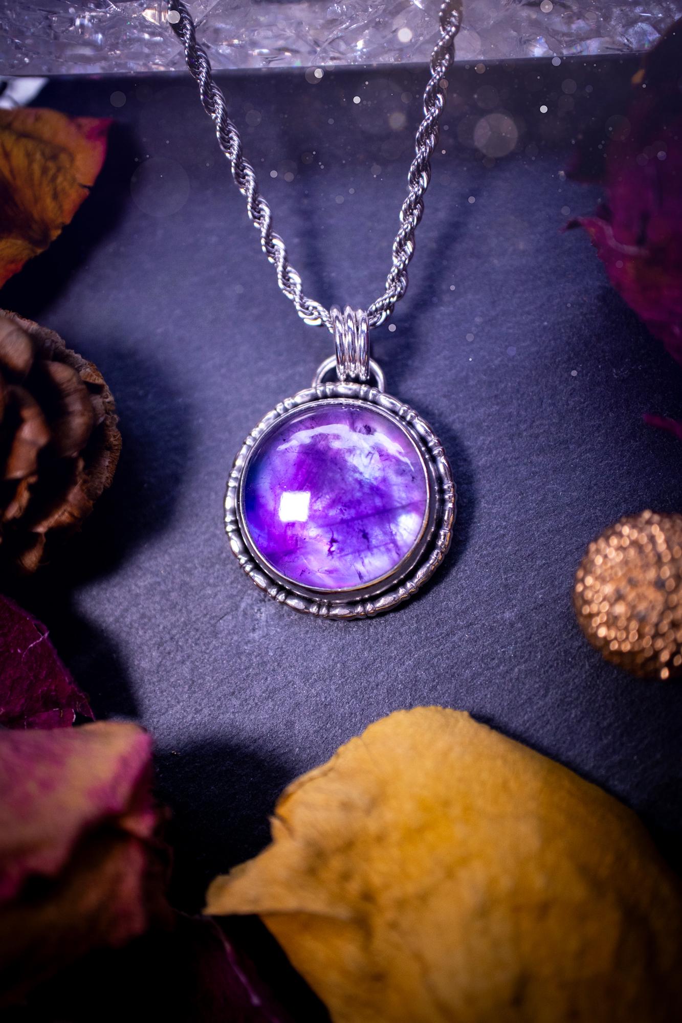Beautifully handmade, and a one of a kind piece, mother of pearl and amethyst doublet, sterling silver pendant necklace. This pendant features the most beautiful MOP and amethyst doublet that is full of dreamy rainbows with a stunning purple hue. The pendant has been crafted using recycled fine and sterling silver, with a minimalistic design and fancy gallery wire around the circular bezel. This piece is ideal for crystal and jewellery lovers, giving hippy and mermaid vibes.