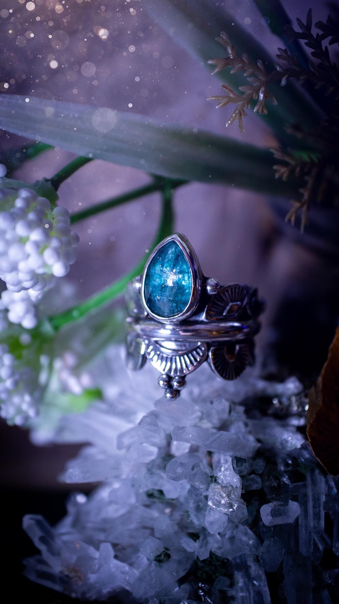 Beautiful and one of a kind, deep blue aqua kyanite crystal, statement ring. Size O 1/2. This stunning and unique ring has been handmade using a high grade kyanite crystal. The kyanite is rose cut giving a gorgeous sparkle, it even has a little shimmering flash. Made from recycled fine and sterling silver and designed with different stamps on a wide band. A very pretty piece to gift to a loved one or to treat yourself. Bohemian, gothic and witchy crystal jewellery.