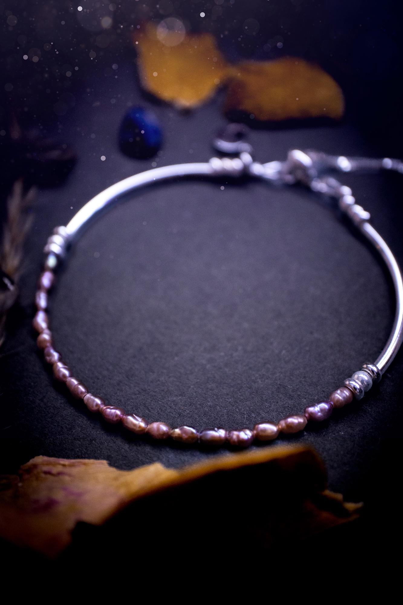 Beautifully handcrafted, pink mother of pearl, sterling silver, slider, stacker bracelet. This bracelet has high quality fresh water pearls that have been strung on 49 strand beading wire which is very strong yet gives a beautiful drape across the wrist. Featuring sterling silver spacer beads, a little moon charm and a bracelet slider as the clasp. This bracelet  would make the ideal gift for crystal lovers and would suit any outfit.