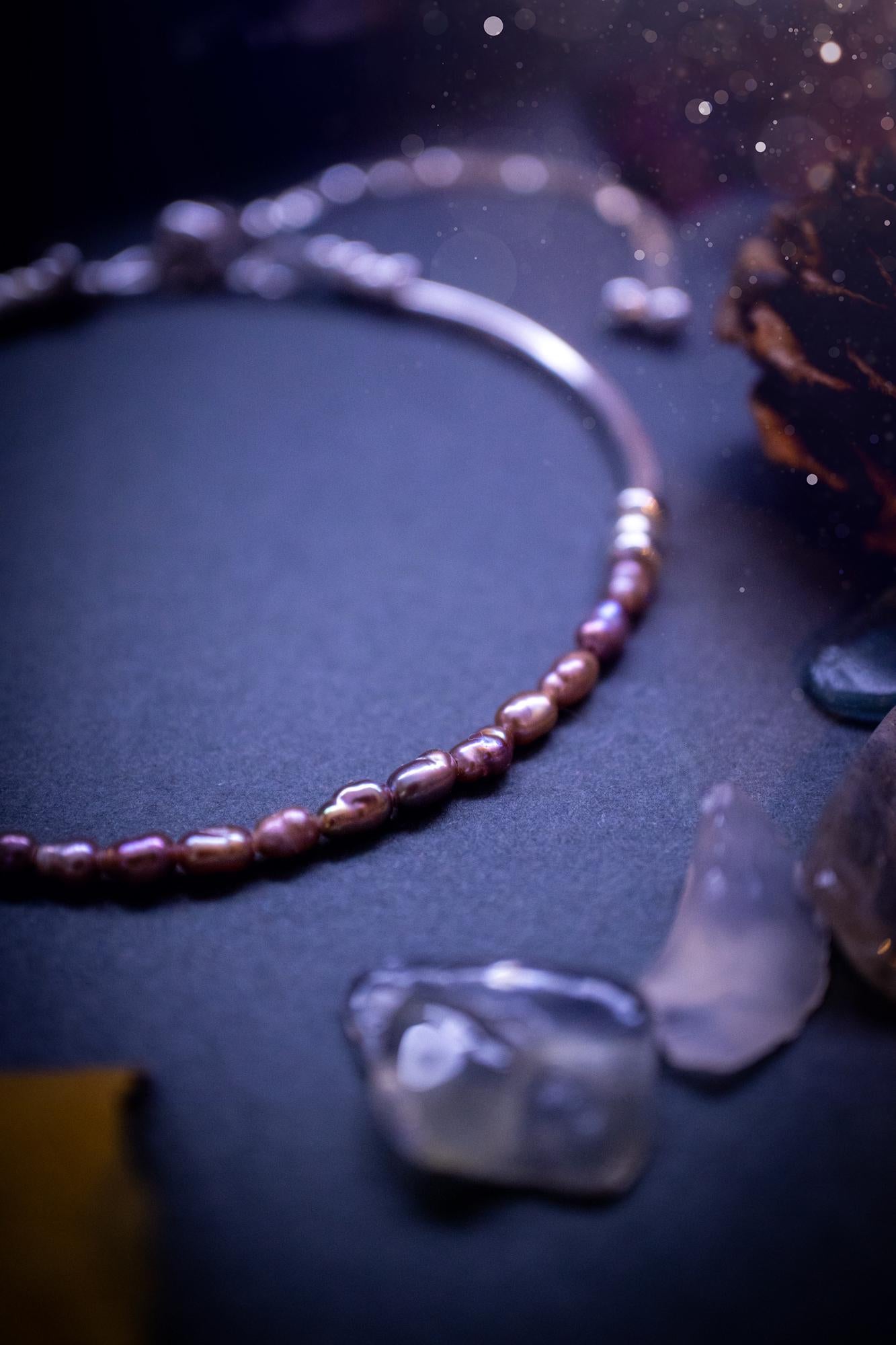 Beautifully handcrafted, pink mother of pearl, sterling silver, slider, stacker bracelet. This bracelet has high quality fresh water pearls that have been strung on 49 strand beading wire which is very strong yet gives a beautiful drape across the wrist. Featuring sterling silver spacer beads, a little moon charm and a bracelet slider as the clasp. This bracelet  would make the ideal gift for crystal lovers and would suit any outfit.