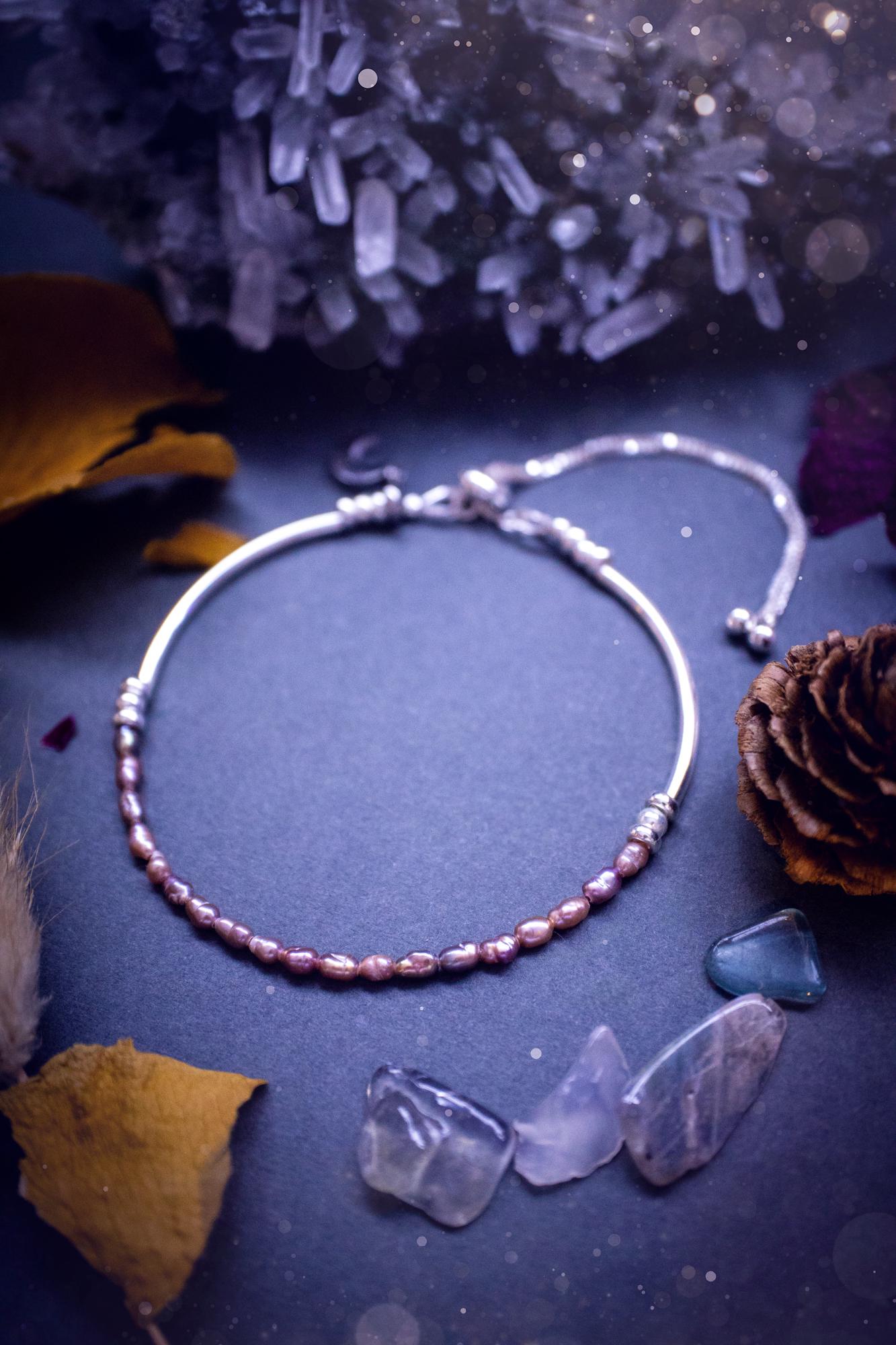 Beautifully handcrafted, pink mother of pearl, sterling silver, slider, stacker bracelet. This bracelet has high quality fresh water pearls that have been strung on 49 strand beading wire which is very strong yet gives a beautiful drape across the wrist. Featuring sterling silver spacer beads, a little moon charm and a bracelet slider as the clasp. This bracelet  would make the ideal gift for crystal lovers and would suit any outfit.