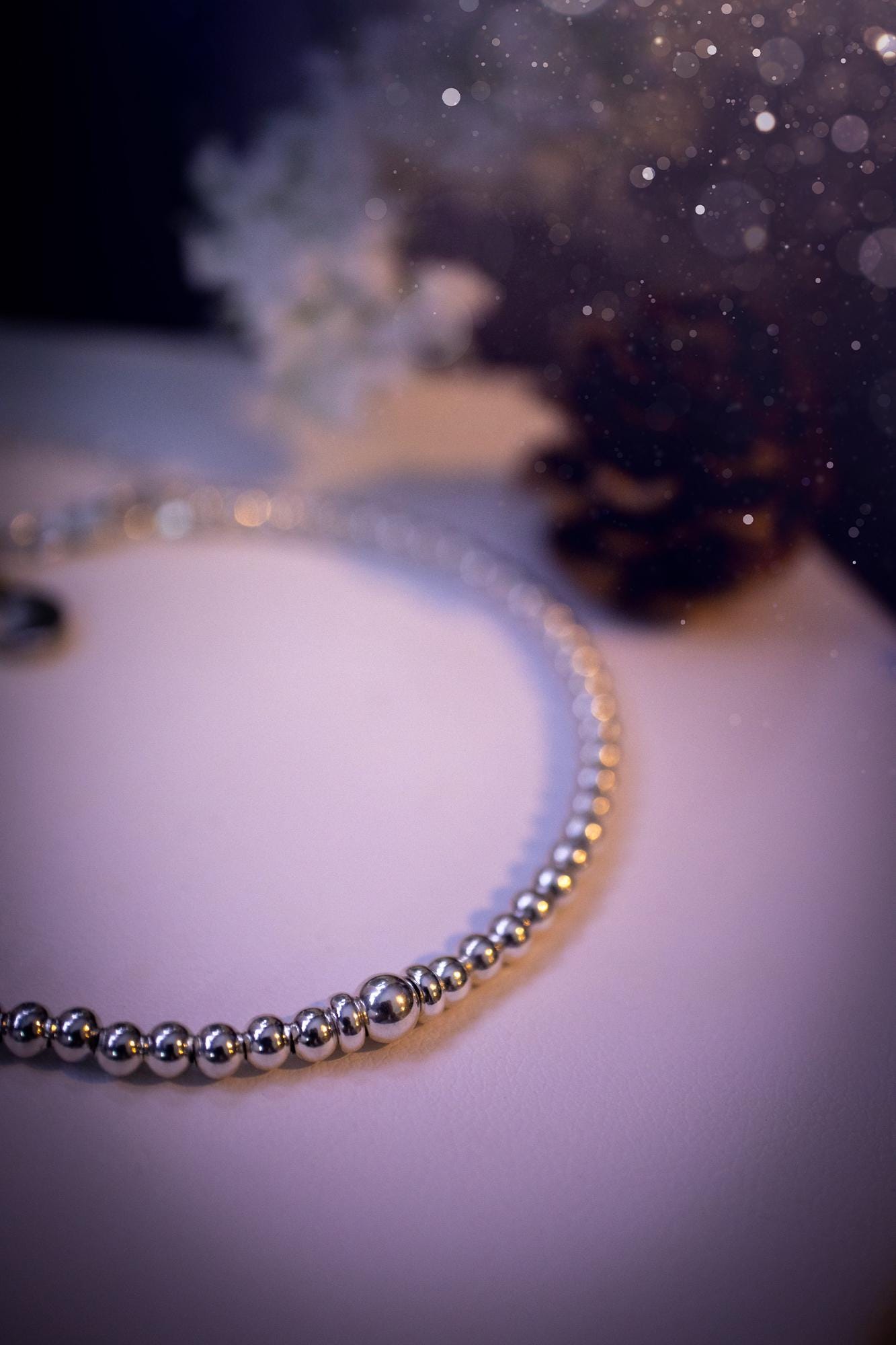 Beautiful and handmade, 3mm beaded, sterling silver stacking bracelet. This bracelet has been made using high quality sterling silver beads which have bee strung on strong 49 strand beading wire. This wire is very strong, but also gives a beautiful drape across the wrist. Featuring one larger silver spacer bead in the middle with rondelle beads either side to give some uniqueness. This bracelet is ideal for stacking with others, and makes a lovely gift for jewellery lovers.