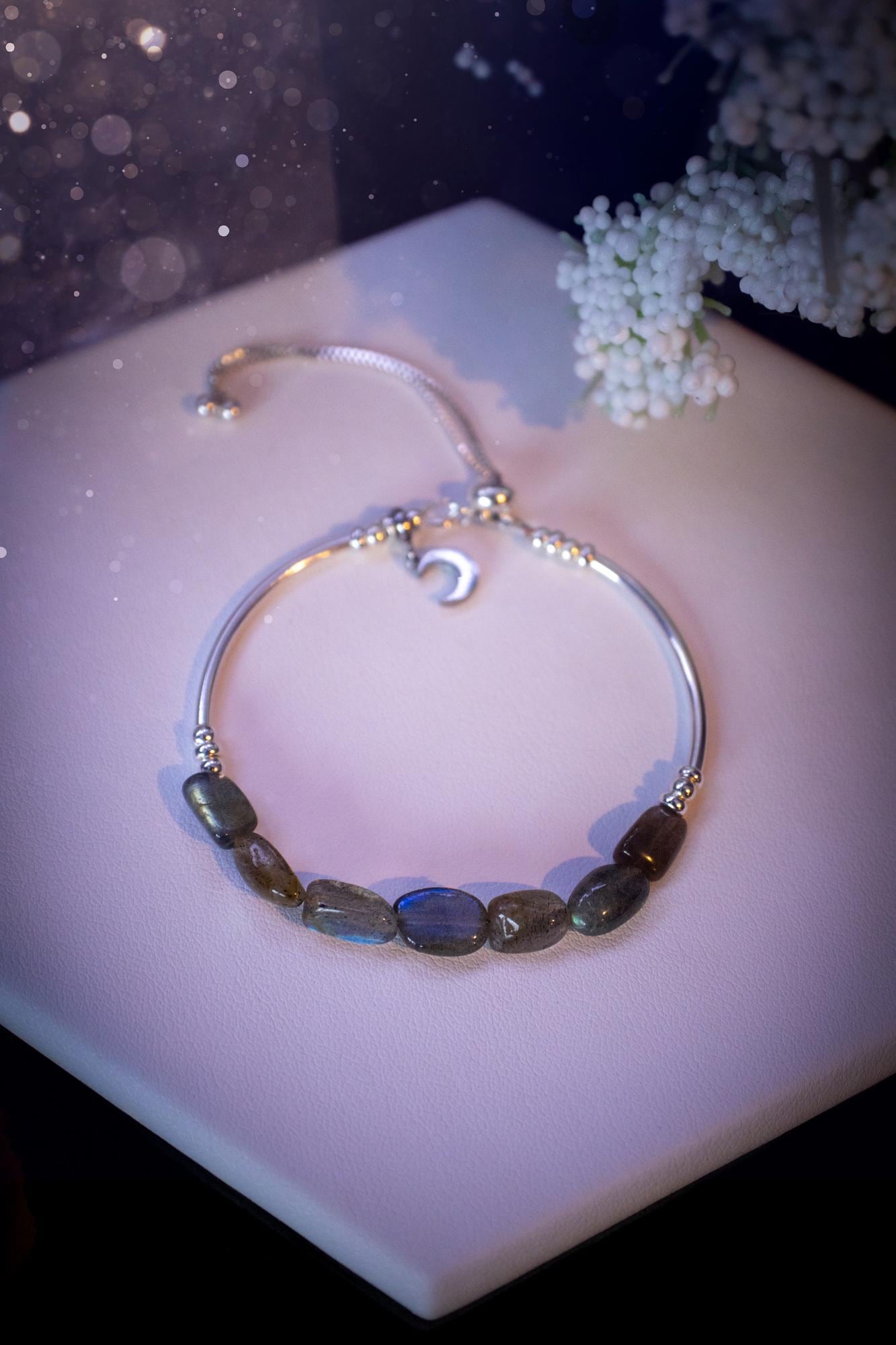 Beautiful and handmade, Labradorite crystal nugget, sterling silver stacking bracelet. This bracelet has been made using high quality sterling silver beads which have bee strung on strong 49 strand beading wire. This wire is very strong, but also gives a beautiful drape across the wrist. Featuring beautiful and flashy labradorite crystal nugget beads. This bracelet is ideal for stacking with others, and makes a lovely gift for jewellery lovers.