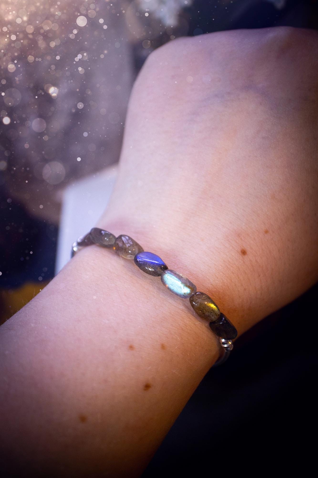 Beautiful and handmade, Labradorite crystal nugget, sterling silver stacking bracelet. This bracelet has been made using high quality sterling silver beads which have bee strung on strong 49 strand beading wire. This wire is very strong, but also gives a beautiful drape across the wrist. Featuring beautiful and flashy labradorite crystal nugget beads. This bracelet is ideal for stacking with others, and makes a lovely gift for jewellery lovers.