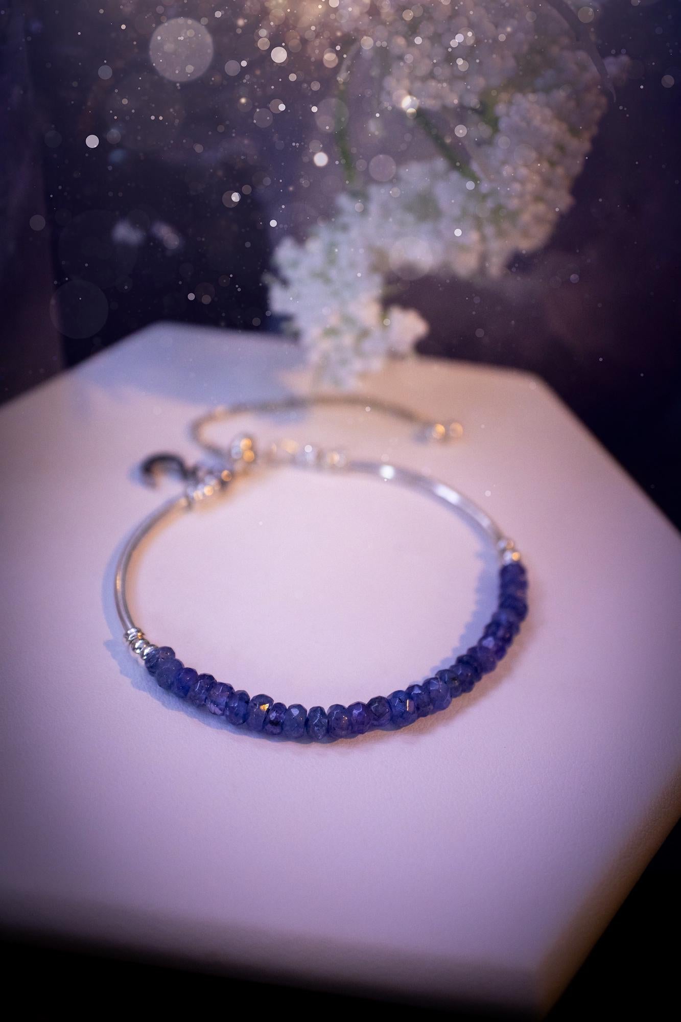 Beautiful and handmade, Tanzanite crystal nugget, sterling silver stacking bracelet. This bracelet has been made using high quality sterling silver beads which have bee strung on strong 49 strand beading wire. This wire is very strong, but also gives a beautiful drape across the wrist. Featuring beautiful and flashy tanzanite crystal nugget beads. This bracelet is ideal for stacking with others, and makes a lovely gift for jewellery lovers.