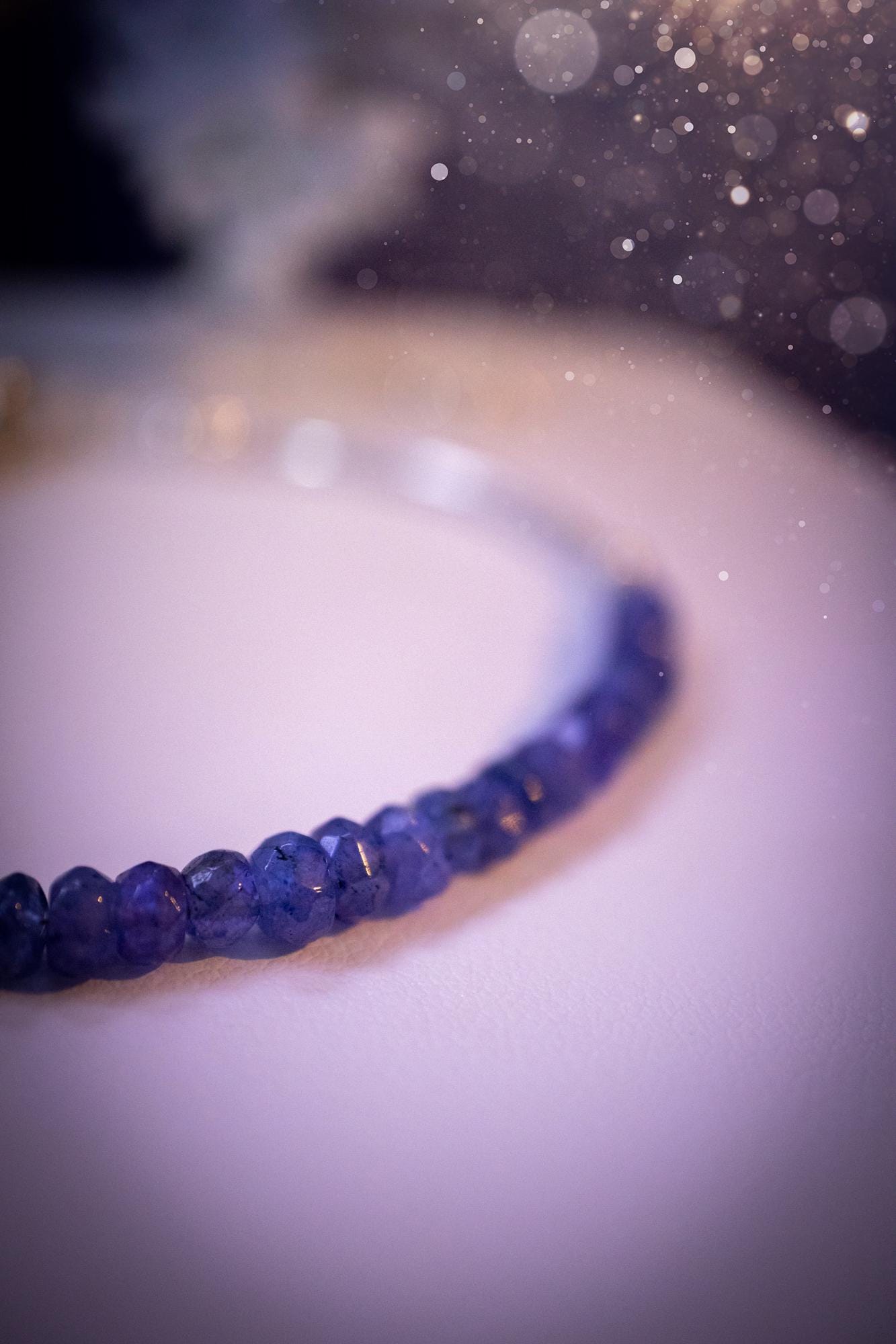 Beautiful and handmade, Tanzanite crystal nugget, sterling silver stacking bracelet. This bracelet has been made using high quality sterling silver beads which have bee strung on strong 49 strand beading wire. This wire is very strong, but also gives a beautiful drape across the wrist. Featuring beautiful and flashy tanzanite crystal nugget beads. This bracelet is ideal for stacking with others, and makes a lovely gift for jewellery lovers.