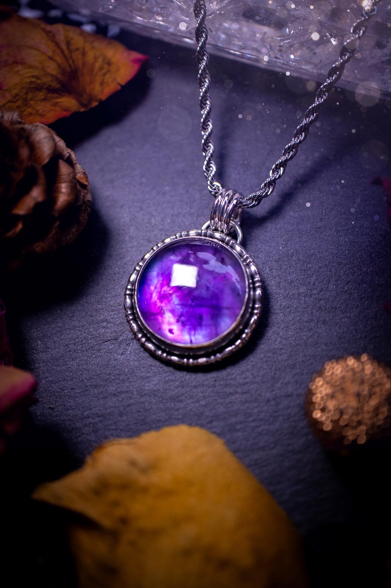 Beautifully handmade, and a one of a kind piece, mother of pearl and amethyst doublet, sterling silver pendant necklace. This pendant features the most beautiful MOP and amethyst doublet that is full of dreamy rainbows with a stunning purple hue. The pendant has been crafted using recycled fine and sterling silver, with a minimalistic design and fancy gallery wire around the circular bezel. This piece is ideal for crystal and jewellery lovers, giving hippy and mermaid vibes.