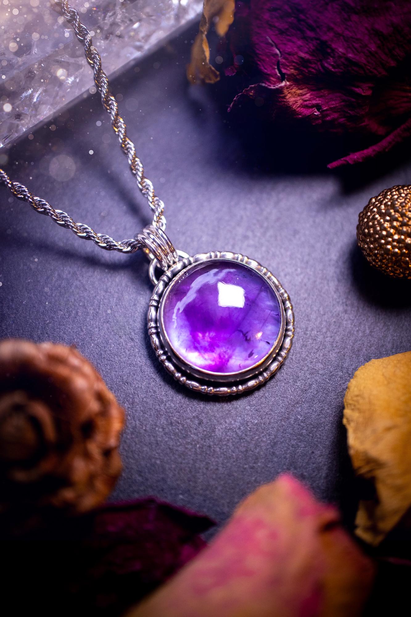 Beautifully handmade, and a one of a kind piece, mother of pearl and amethyst doublet, sterling silver pendant necklace. This pendant features the most beautiful MOP and amethyst doublet that is full of dreamy rainbows with a stunning purple hue. The pendant has been crafted using recycled fine and sterling silver, with a minimalistic design and fancy gallery wire around the circular bezel. This piece is ideal for crystal and jewellery lovers, giving hippy and mermaid vibes.