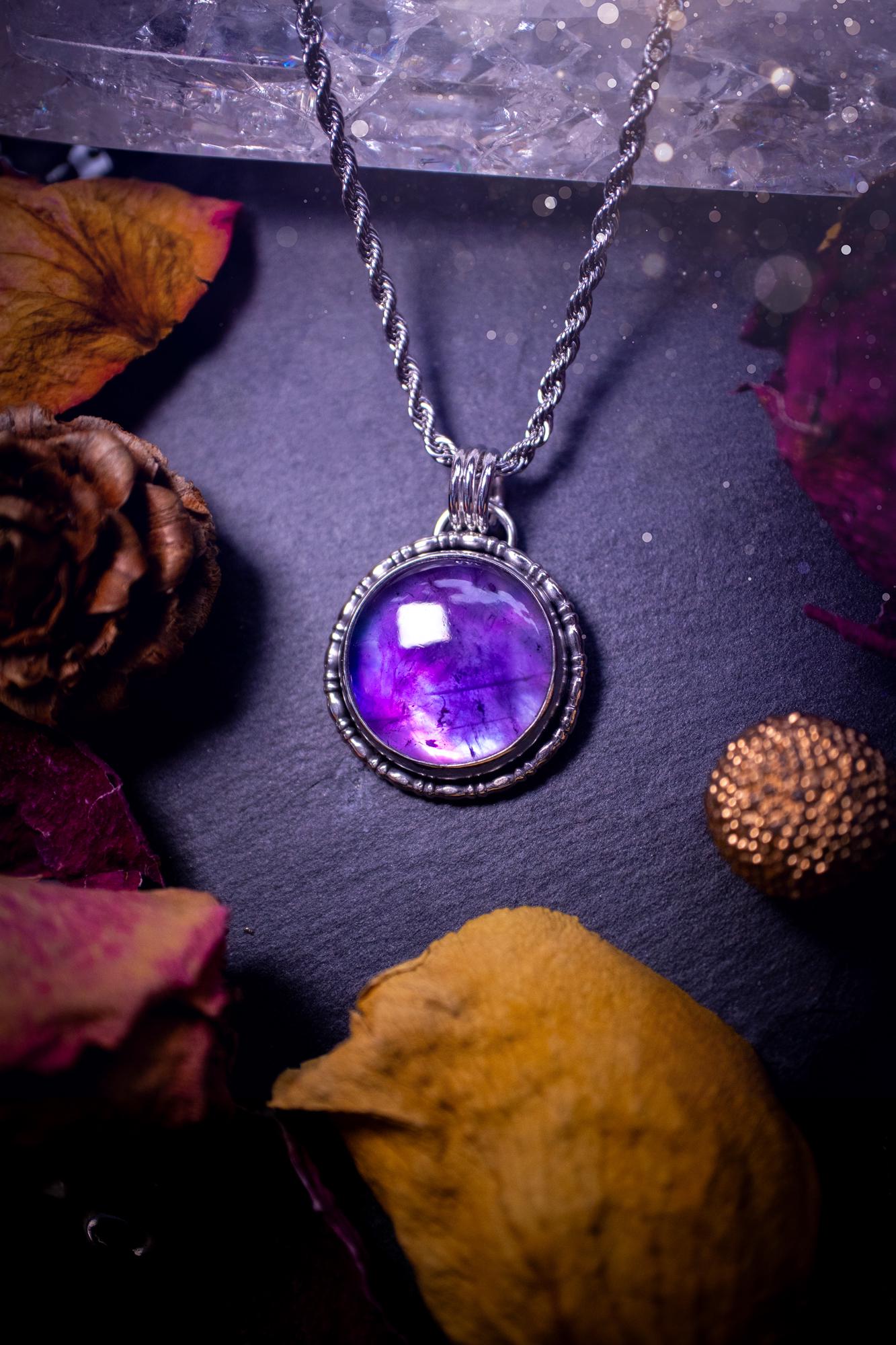 Beautifully handmade, and a one of a kind piece, mother of pearl and amethyst doublet, sterling silver pendant necklace. This pendant features the most beautiful MOP and amethyst doublet that is full of dreamy rainbows with a stunning purple hue. The pendant has been crafted using recycled fine and sterling silver, with a minimalistic design and fancy gallery wire around the circular bezel. This piece is ideal for crystal and jewellery lovers, giving hippy and mermaid vibes.