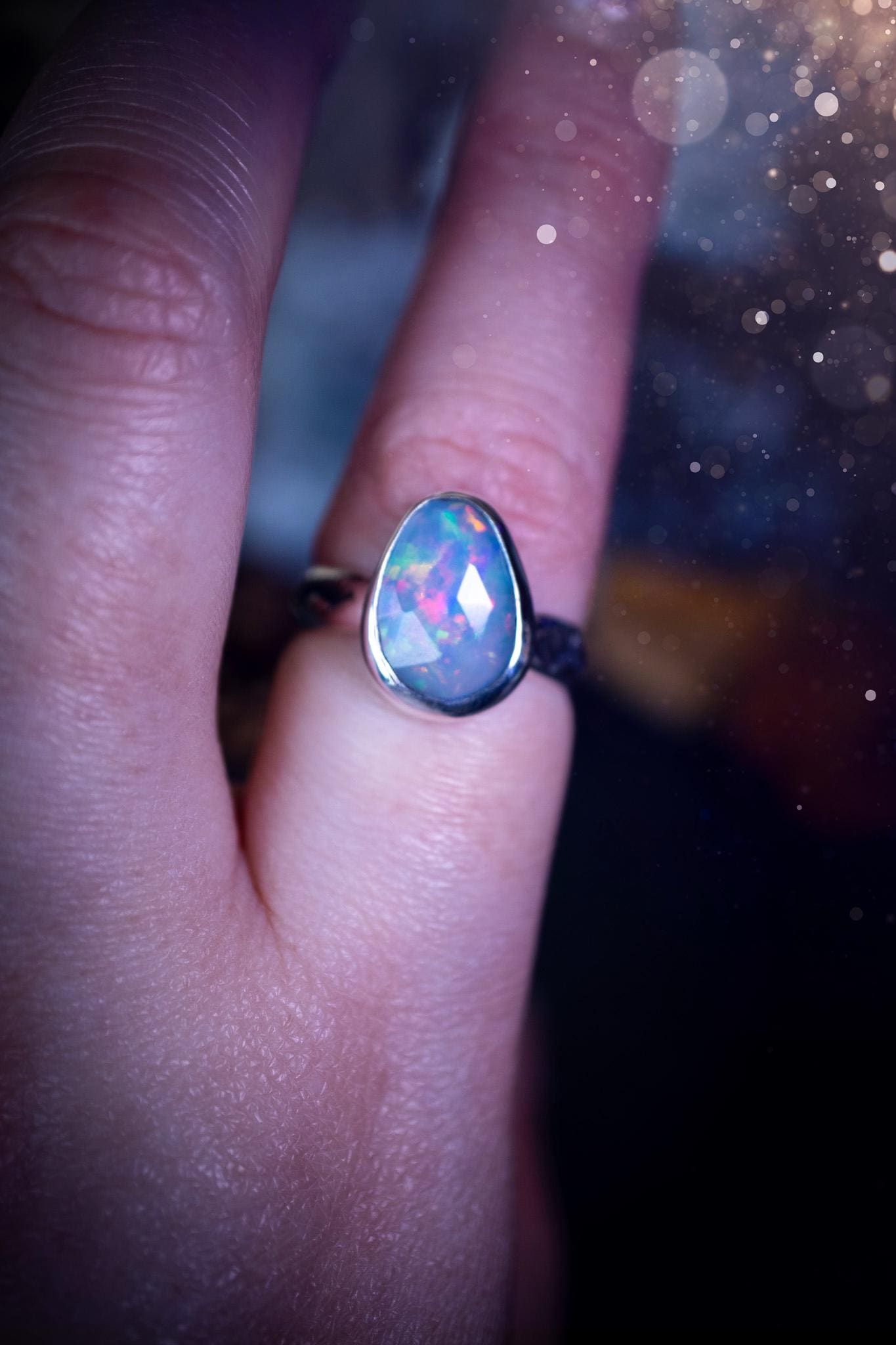 Handmade and beautiful, natural, Ethiopian welo opal, sterling silver stacking ring. This beautiful ring is a size O 1/2 and features the most stunning sparkly opal. Made from recycled fine and sterling silver with a thick stamped ring shank. The ideal gift for any crystal or jewellery lover. Opal is the birthstone for October. Gothic and witchy jewellery