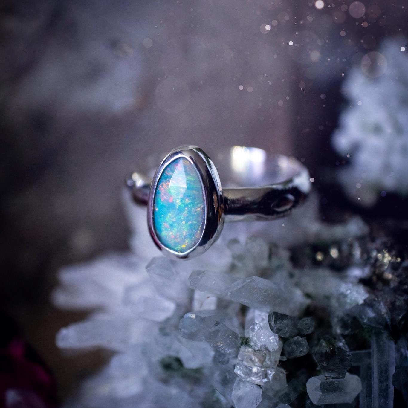 Handmade and beautiful, natural, Ethiopian welo opal, sterling silver stacking ring. This beautiful ring is a size T and features the most stunning sparkly opal. Made from recycled fine and sterling silver with a thick stamped ring shank. The ideal gift for any crystal or jewellery lover. Opal is the birthstone for October. Gothic and witchy jewellery, hippy and bohemian.