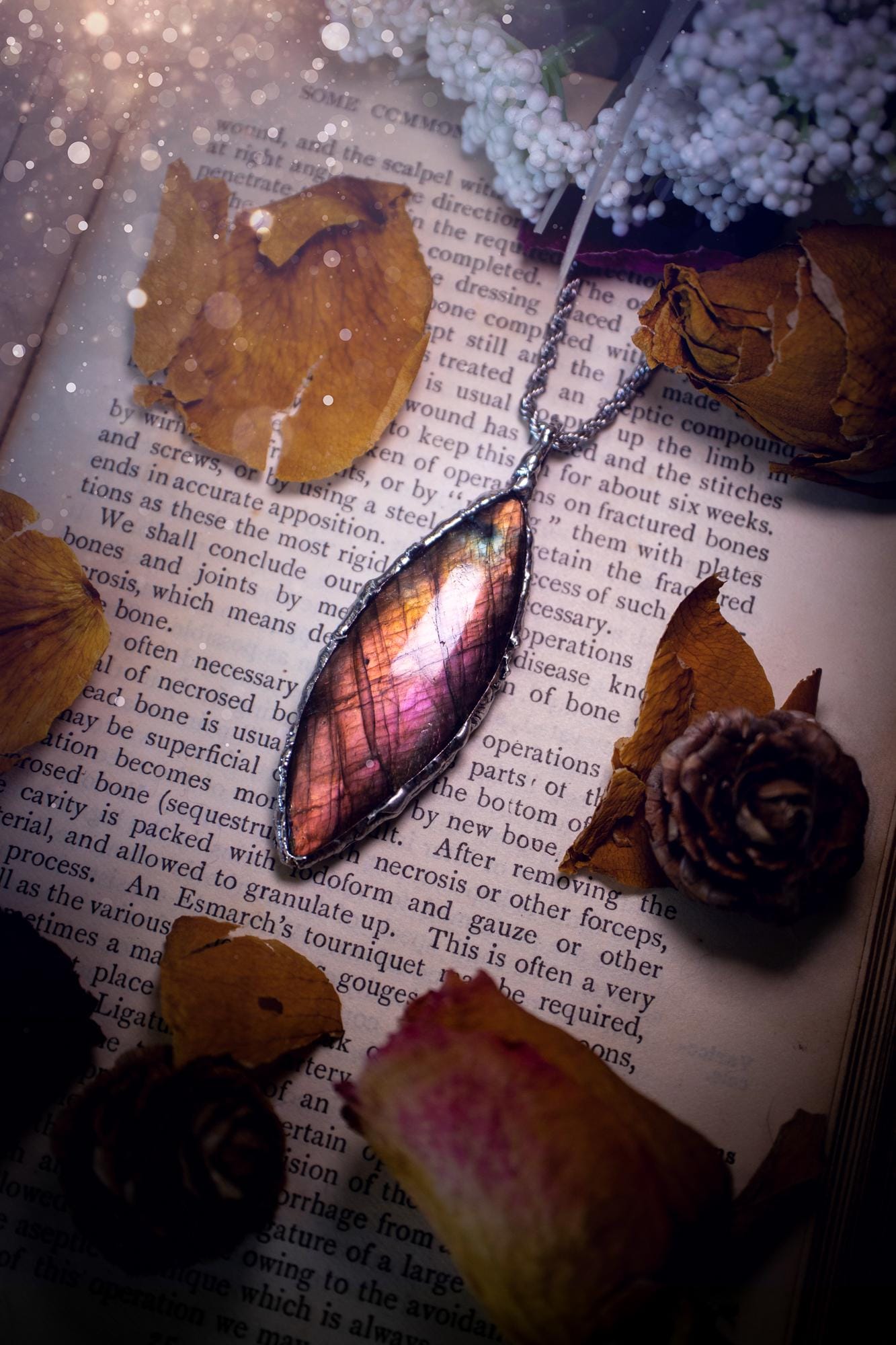A beautiful, one of a kind, pink, purple and orange multi-flash Labradorite crystal pendant necklace. This pendant has been handmade using the soft solder method, also known as the tiffany technique used to create stained glass windows. Featuring the most stunning and natural Labradorite crystal which is full of purple and pink hues. The pendant is suitable for gifting to any jewellery or crystal lover, or to simply add to your own collection. One of a kind jewellery, gothic and witchy gifts
