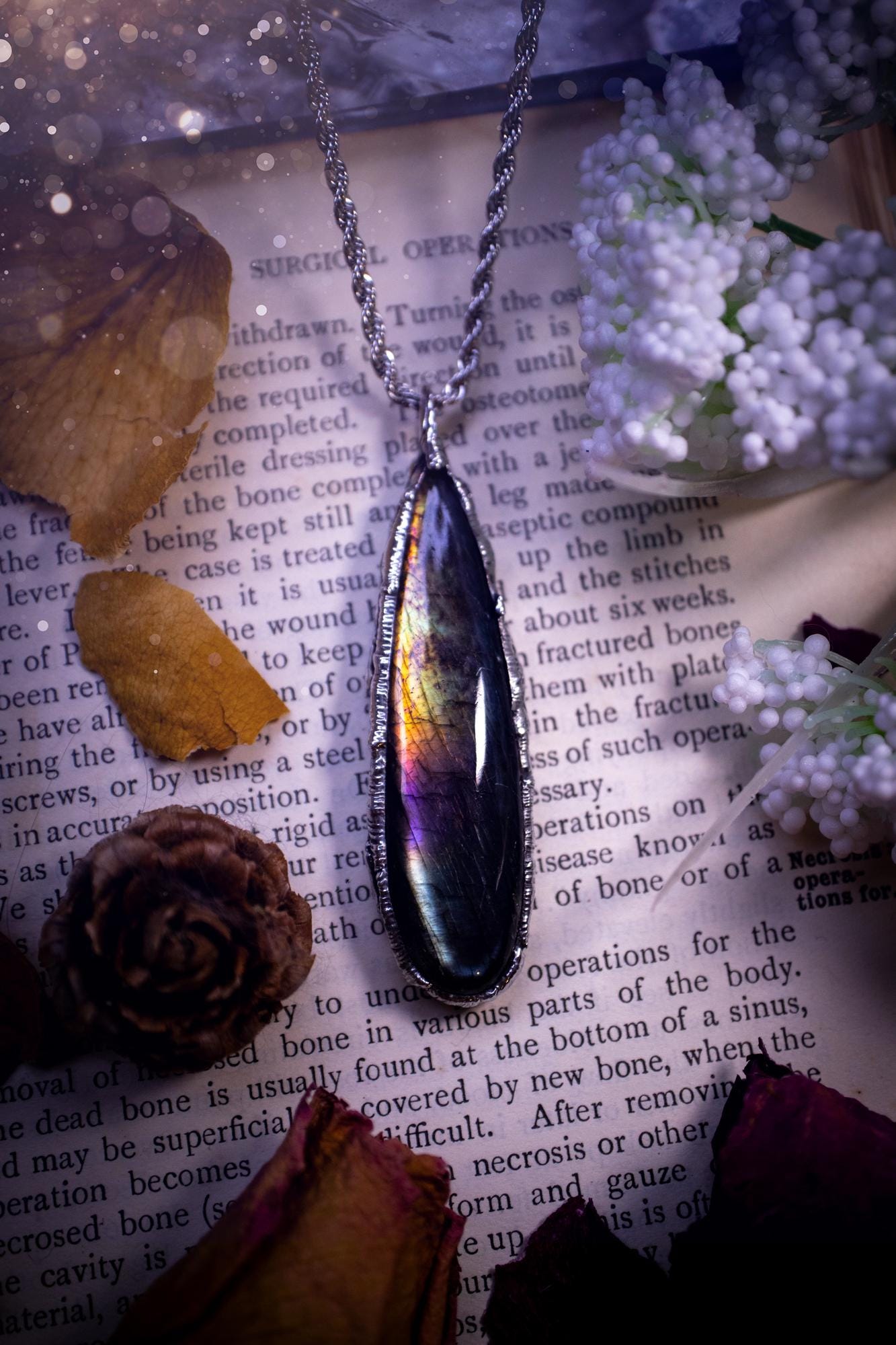 A beautiful, one of a kind, purple, green and grey multi-flash Labradorite crystal pendant necklace. This pendant has been handmade using the soft solder method, also known as the tiffany technique used to create stained glass windows. Featuring the most stunning and natural Labradorite crystal which is full of purple and green hues. The pendant is suitable for gifting to any jewellery or crystal lover, or to simply add to your own collection. One of a kind jewellery, gothic and witchy gifts