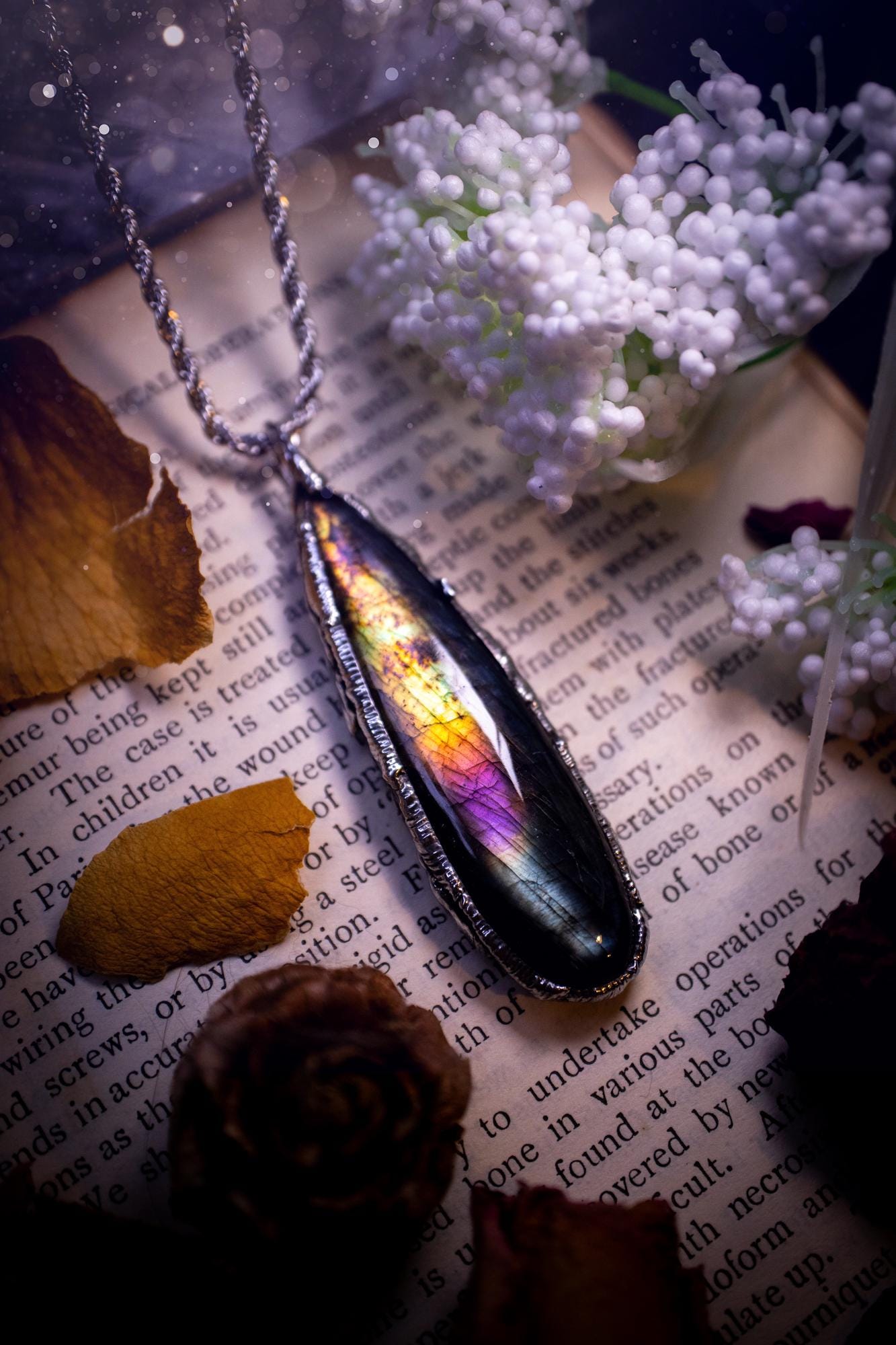 A beautiful, one of a kind, purple, green and grey multi-flash Labradorite crystal pendant necklace. This pendant has been handmade using the soft solder method, also known as the tiffany technique used to create stained glass windows. Featuring the most stunning and natural Labradorite crystal which is full of purple and green hues. The pendant is suitable for gifting to any jewellery or crystal lover, or to simply add to your own collection. One of a kind jewellery, gothic and witchy gifts
