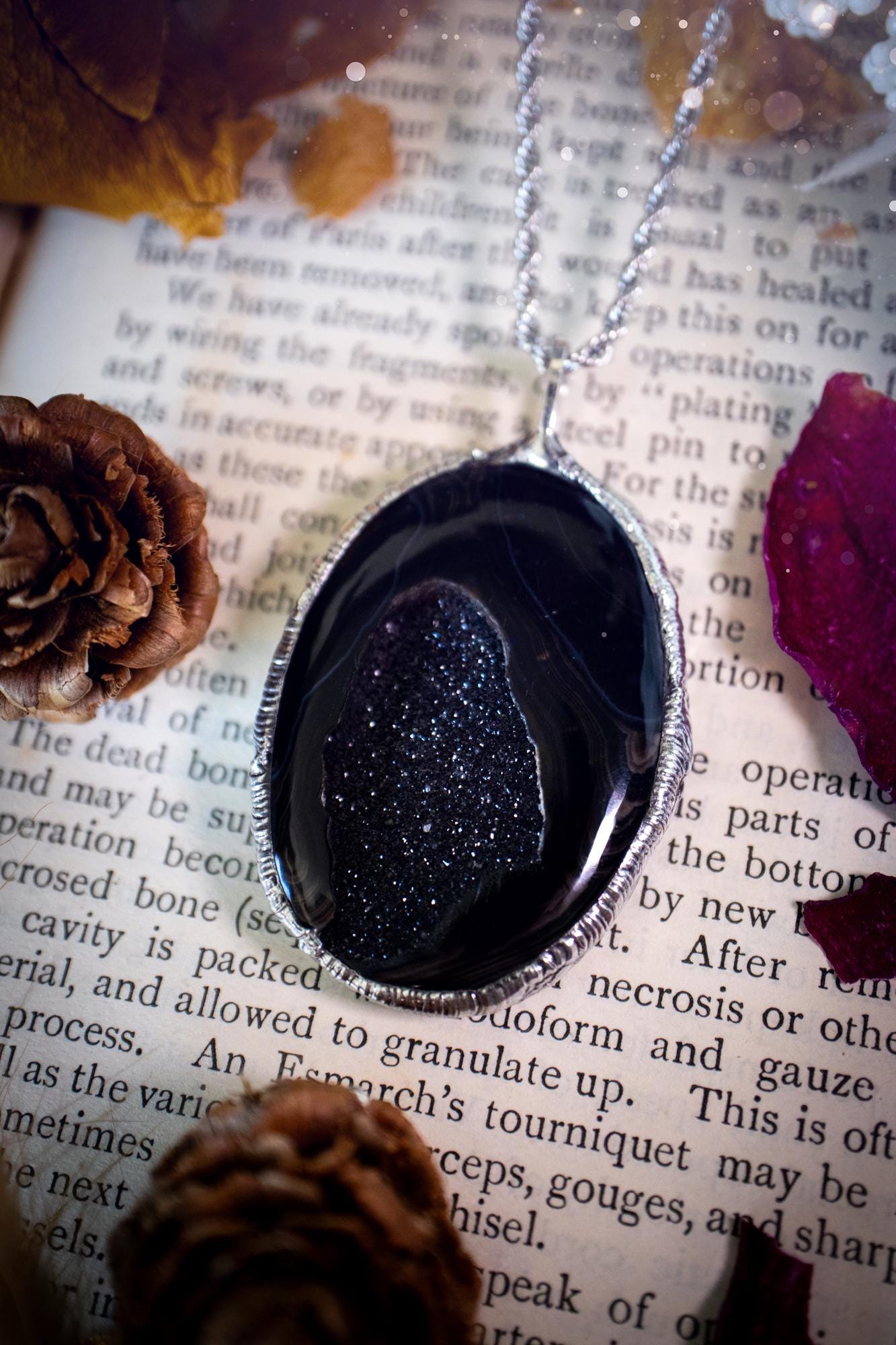 Beautiful and handcrafted, black druzy agate, crystal pendant necklace. This one of a kind piece of jewellery has been hand made using the tiffany technique, also known as soft soldering. The bezel is made with a solder that is lead free and contains elements of silver so when polished a high lustre is achieved. Featuring a large druzy agate with beautiful sparkle and banding. This is the ideal gift for any crystal or jewellery lover that likes a gothic and witchy vibe and aesthetic.