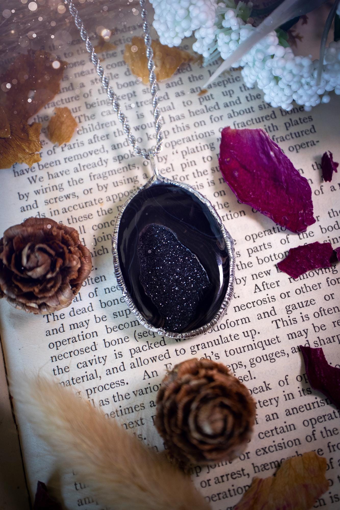 Beautiful and handcrafted, black druzy agate, crystal pendant necklace. This one of a kind piece of jewellery has been hand made using the tiffany technique, also known as soft soldering. The bezel is made with a solder that is lead free and contains elements of silver so when polished a high lustre is achieved. Featuring a large druzy agate with beautiful sparkle and banding. This is the ideal gift for any crystal or jewellery lover that likes a gothic and witchy vibe and aesthetic.