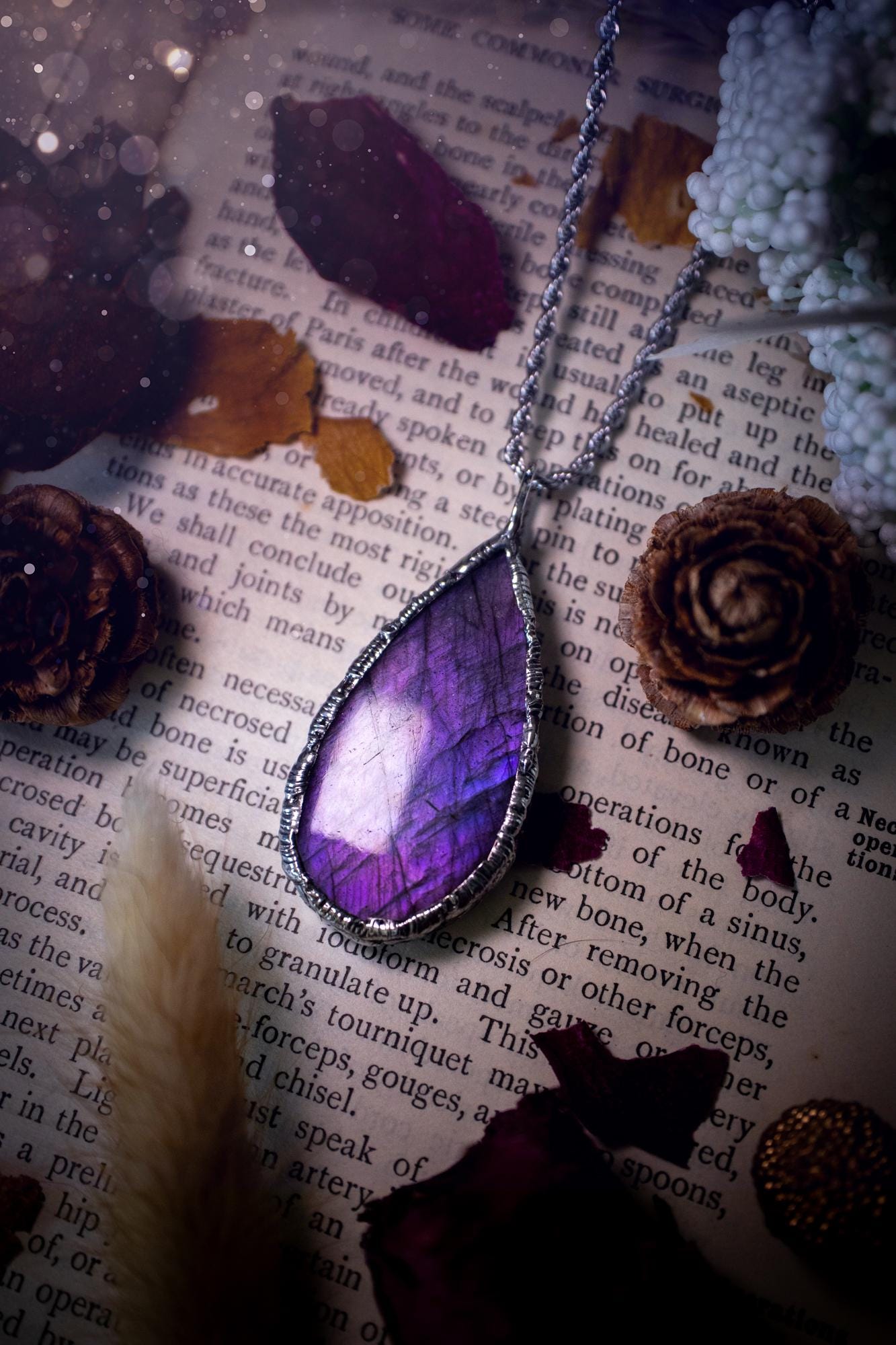 A beautiful, one of a kind, purple, green and grey multi-flash Labradorite crystal pendant necklace. This pendant has been handmade using the soft solder method, also known as the tiffany technique used to create stained glass windows. Featuring the most stunning and natural Labradorite crystal which is full of purple and green hues. The pendant is suitable for gifting to any jewellery or crystal lover, or to simply add to your own collection. One of a kind jewellery, gothic and witchy gifts
