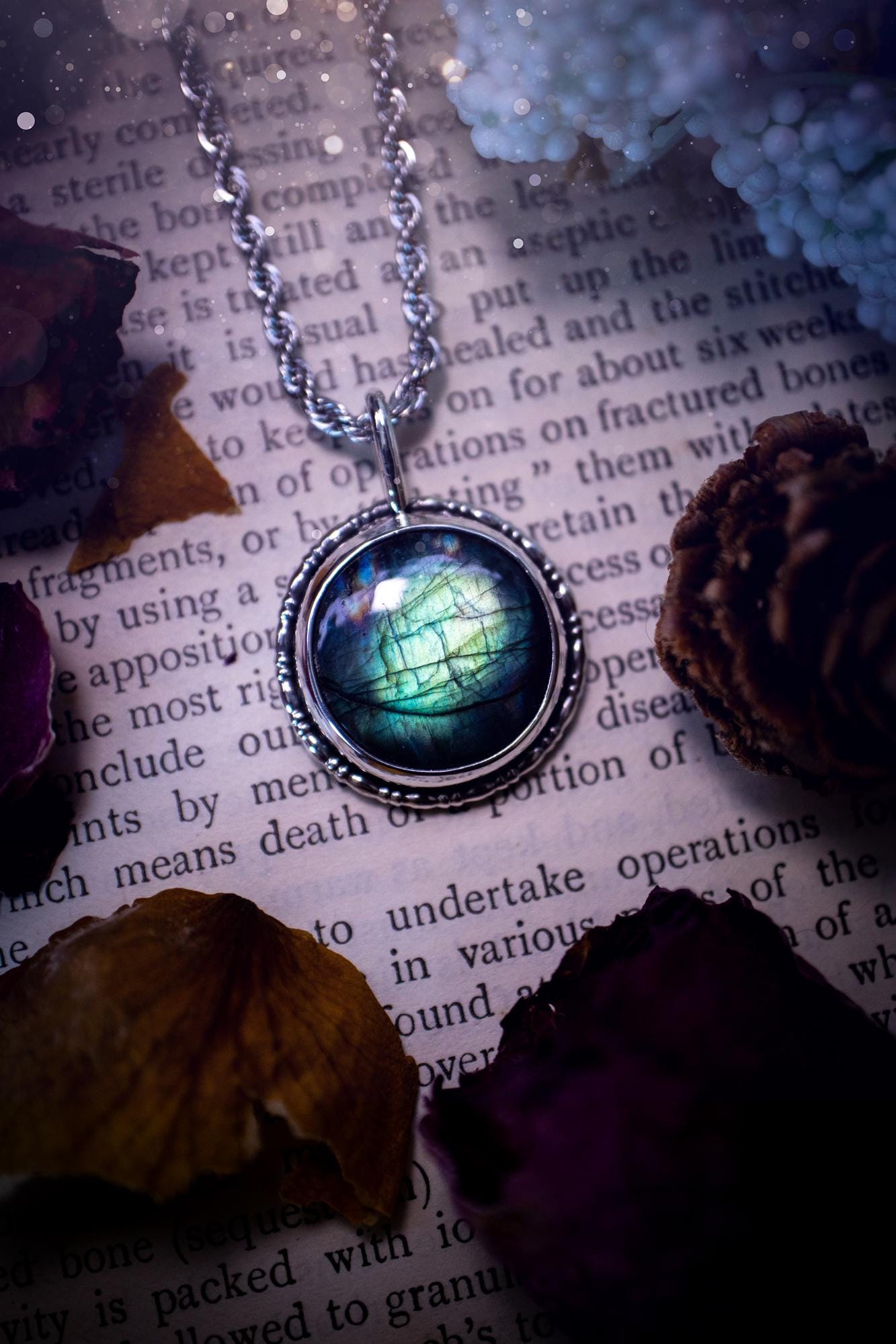 Beautiful and handmade, teal green with a little rainbow, sterling silver pendant necklace. This necklace features a beautiful, forest teal green Labradorite crystal that is completely natural. The pendant itself has been handcrafted using a mix of 999 fine and sterling silver with gallery wire around the bezel to give it a unique feel. A one of a kind piece of jewellery that would complete any crystal or jewellery lovers collection. Witchy and gothic vibes, jewellery gifts for her.