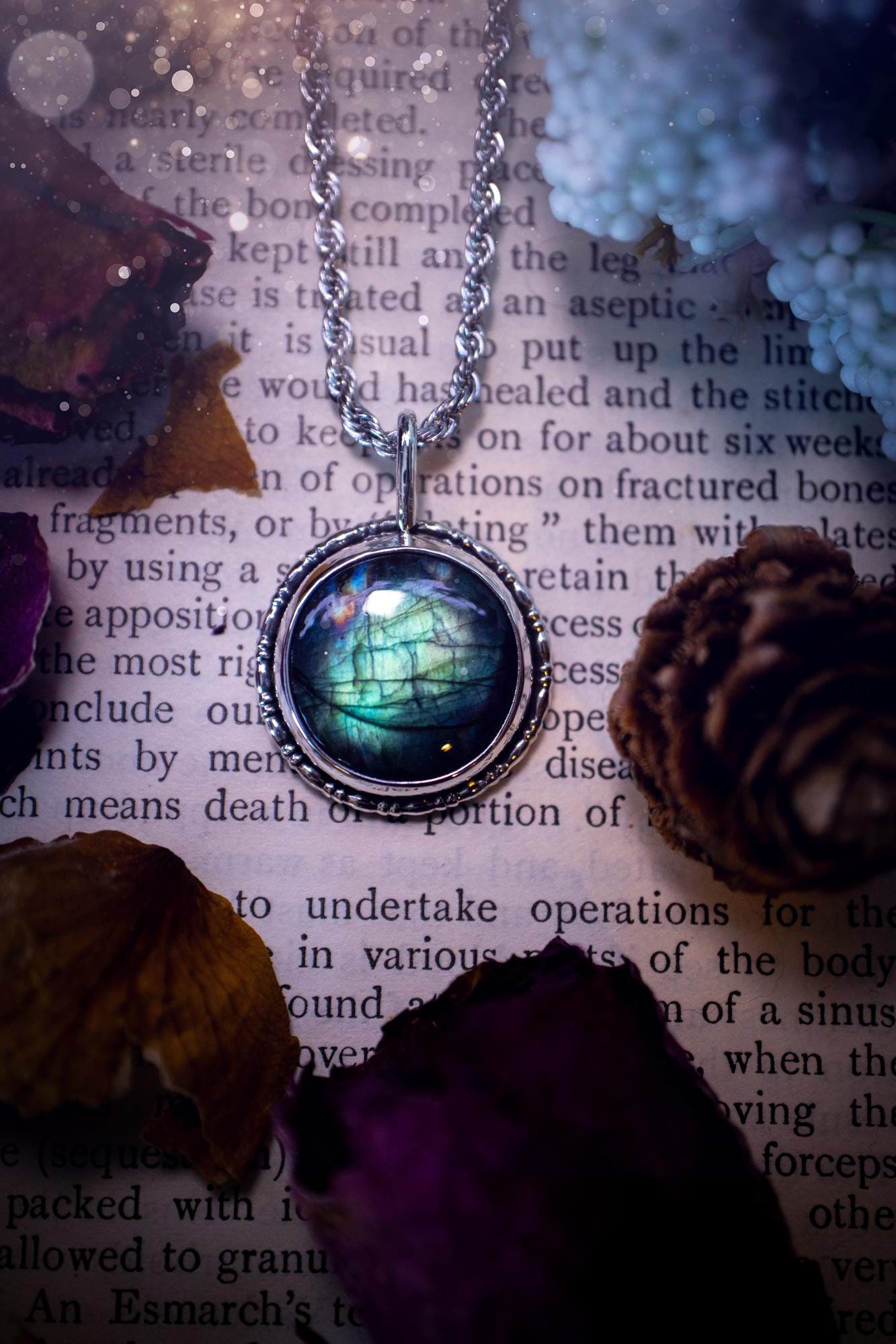 Beautiful and handmade, teal green with a little rainbow, sterling silver pendant necklace. This necklace features a beautiful, forest teal green Labradorite crystal that is completely natural. The pendant itself has been handcrafted using a mix of 999 fine and sterling silver with gallery wire around the bezel to give it a unique feel. A one of a kind piece of jewellery that would complete any crystal or jewellery lovers collection. Witchy and gothic vibes, jewellery gifts for her.