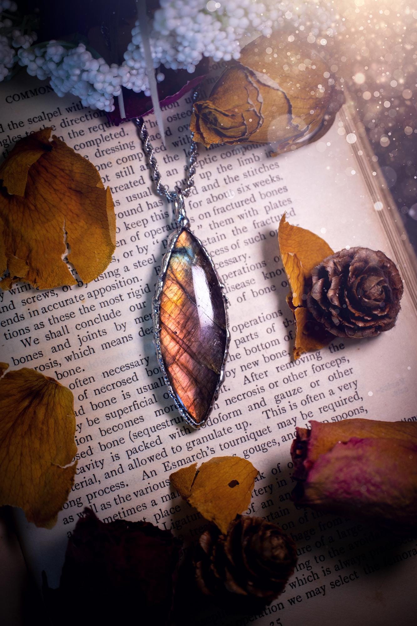 A beautiful, one of a kind, pink, purple and orange multi-flash Labradorite crystal pendant necklace. This pendant has been handmade using the soft solder method, also known as the tiffany technique used to create stained glass windows. Featuring the most stunning and natural Labradorite crystal which is full of purple and pink hues. The pendant is suitable for gifting to any jewellery or crystal lover, or to simply add to your own collection. One of a kind jewellery, gothic and witchy gifts
