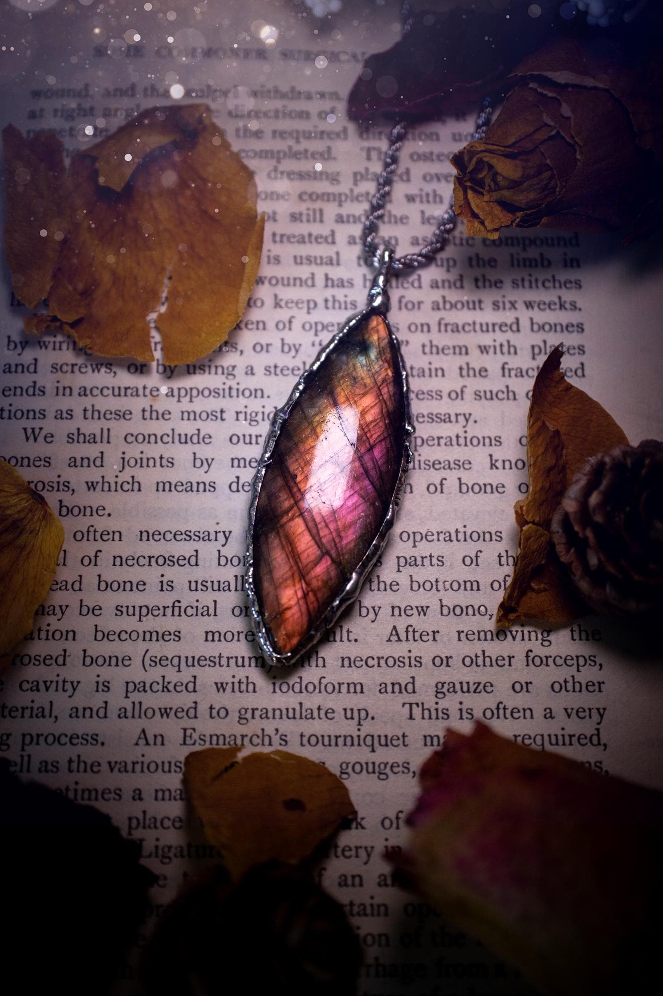 A beautiful, one of a kind, pink, purple and orange multi-flash Labradorite crystal pendant necklace. This pendant has been handmade using the soft solder method, also known as the tiffany technique used to create stained glass windows. Featuring the most stunning and natural Labradorite crystal which is full of purple and pink hues. The pendant is suitable for gifting to any jewellery or crystal lover, or to simply add to your own collection. One of a kind jewellery, gothic and witchy gifts