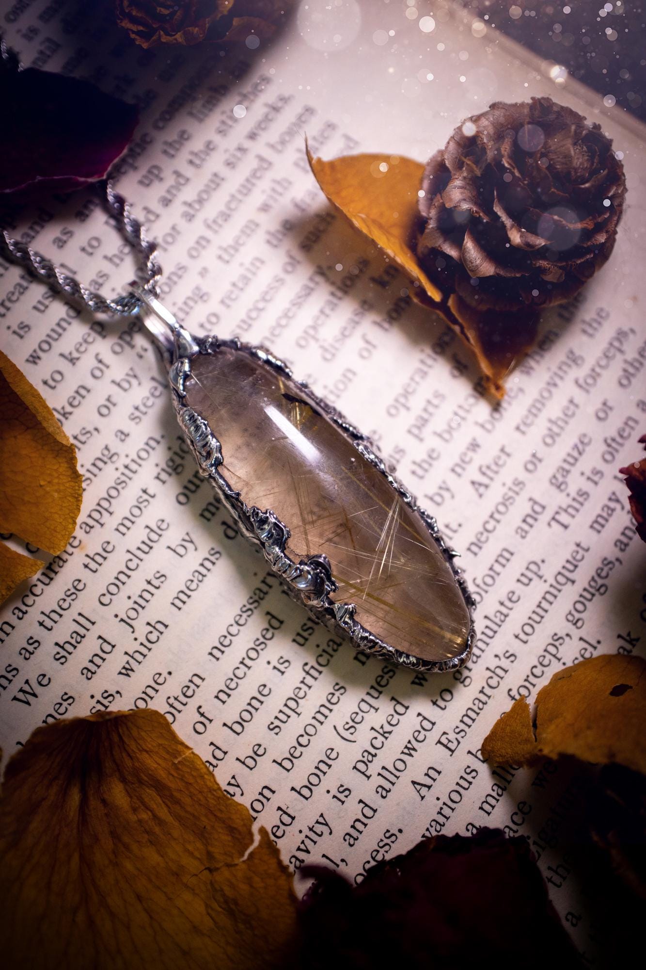 Handcrafted and unique, golden rutile quartz crystal, soft soldered pendant necklace. This pendant necklace has been handcrafted using the soft soldering method, also known as the tiffany technique. This method uses lead free solder which contains elements of silver for a high polish. This pendant features the most gorgeous and high quality, gold rutile quartz full of golden stripes with high clarity. Ideal gift for crystal and jewellery lovers. Witchy and gothic jewellery gifts for her.