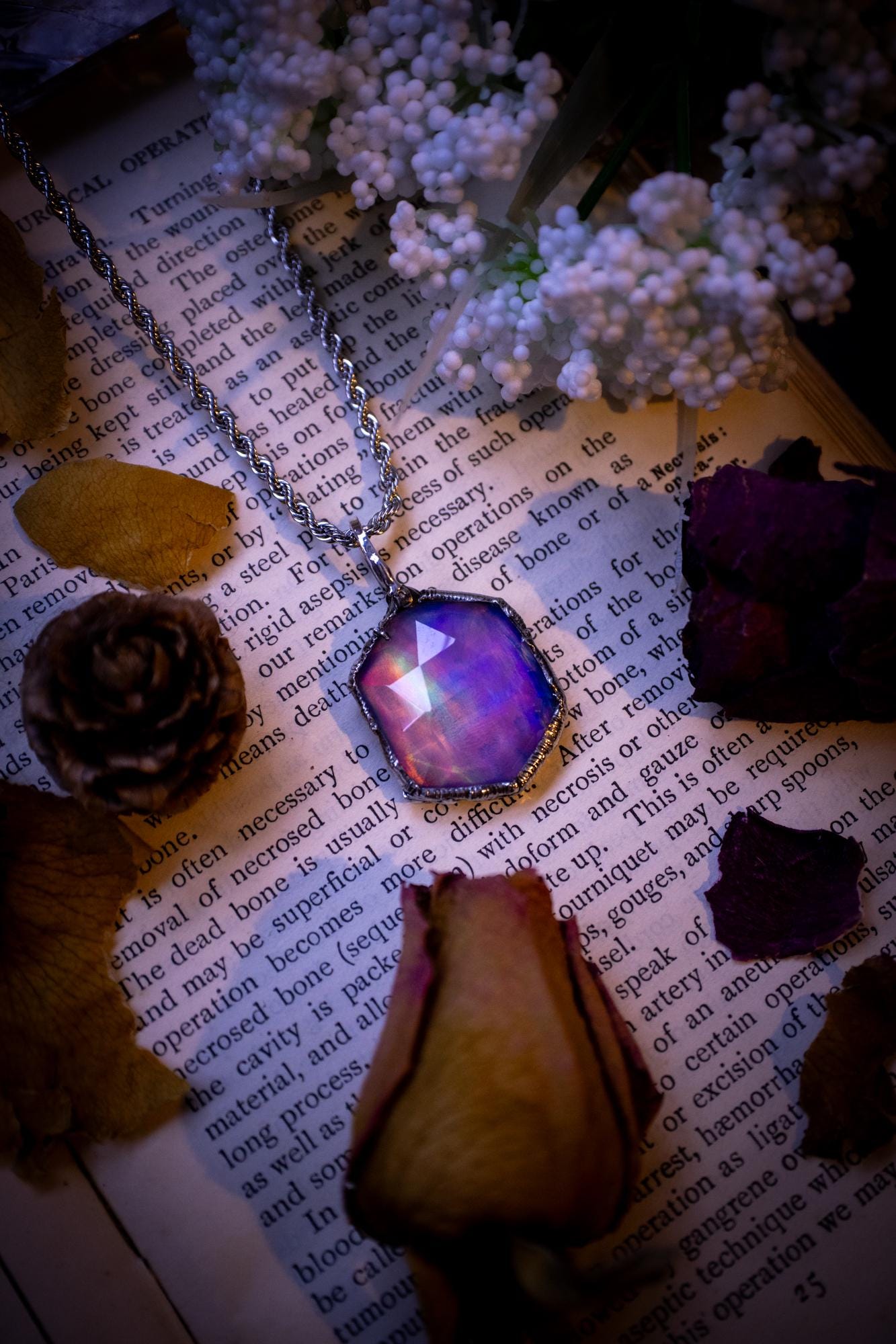 A beautiful, one of a kind, aurora opal pendant necklace. This little statement necklace is handmade using the tiffany technique, also known as soft soldering. Featuring the most stunning, and sparkly aurora opal which is full of pinks, greens and blues just like the northern lights. Aurora opals are man made opals that look similar to natural ones, they have a layer of rose quartz on top to give extra shine. The ideal gift for any crystal or jewellery lover. Gothic and witchy jewellery