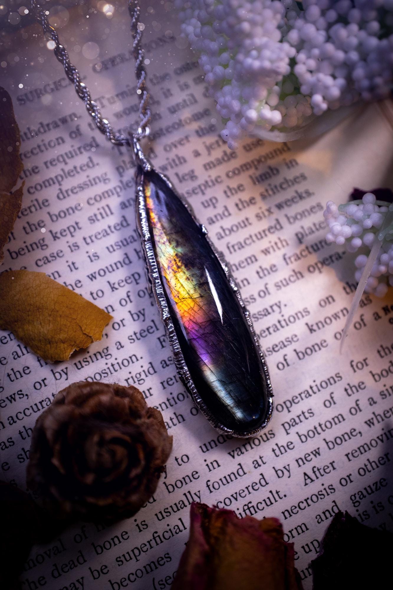 A beautiful, one of a kind, purple, green and grey multi-flash Labradorite crystal pendant necklace. This pendant has been handmade using the soft solder method, also known as the tiffany technique used to create stained glass windows. Featuring the most stunning and natural Labradorite crystal which is full of purple and green hues. The pendant is suitable for gifting to any jewellery or crystal lover, or to simply add to your own collection. One of a kind jewellery, gothic and witchy gifts