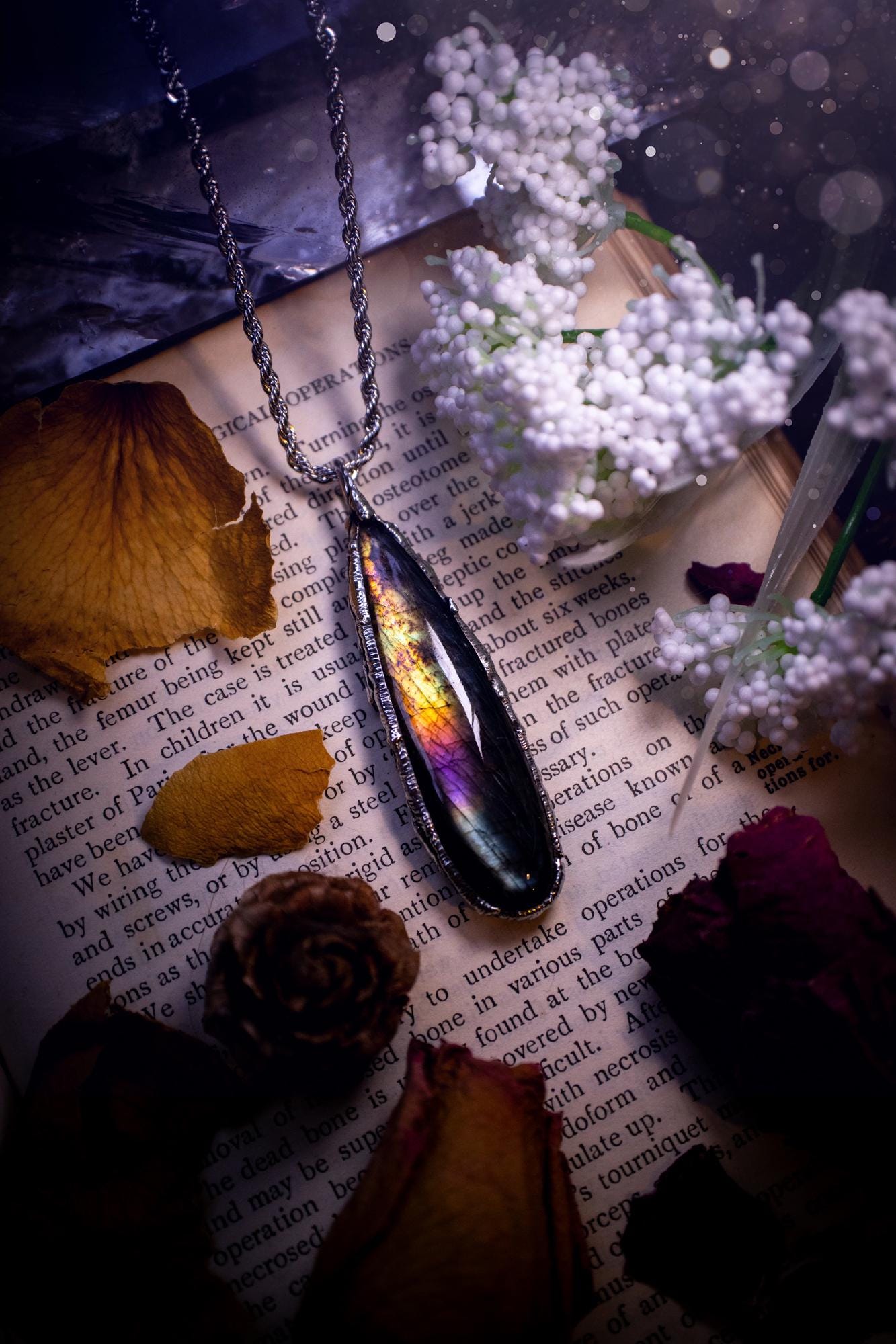 A beautiful, one of a kind, purple, green and grey multi-flash Labradorite crystal pendant necklace. This pendant has been handmade using the soft solder method, also known as the tiffany technique used to create stained glass windows. Featuring the most stunning and natural Labradorite crystal which is full of purple and green hues. The pendant is suitable for gifting to any jewellery or crystal lover, or to simply add to your own collection. One of a kind jewellery, gothic and witchy gifts