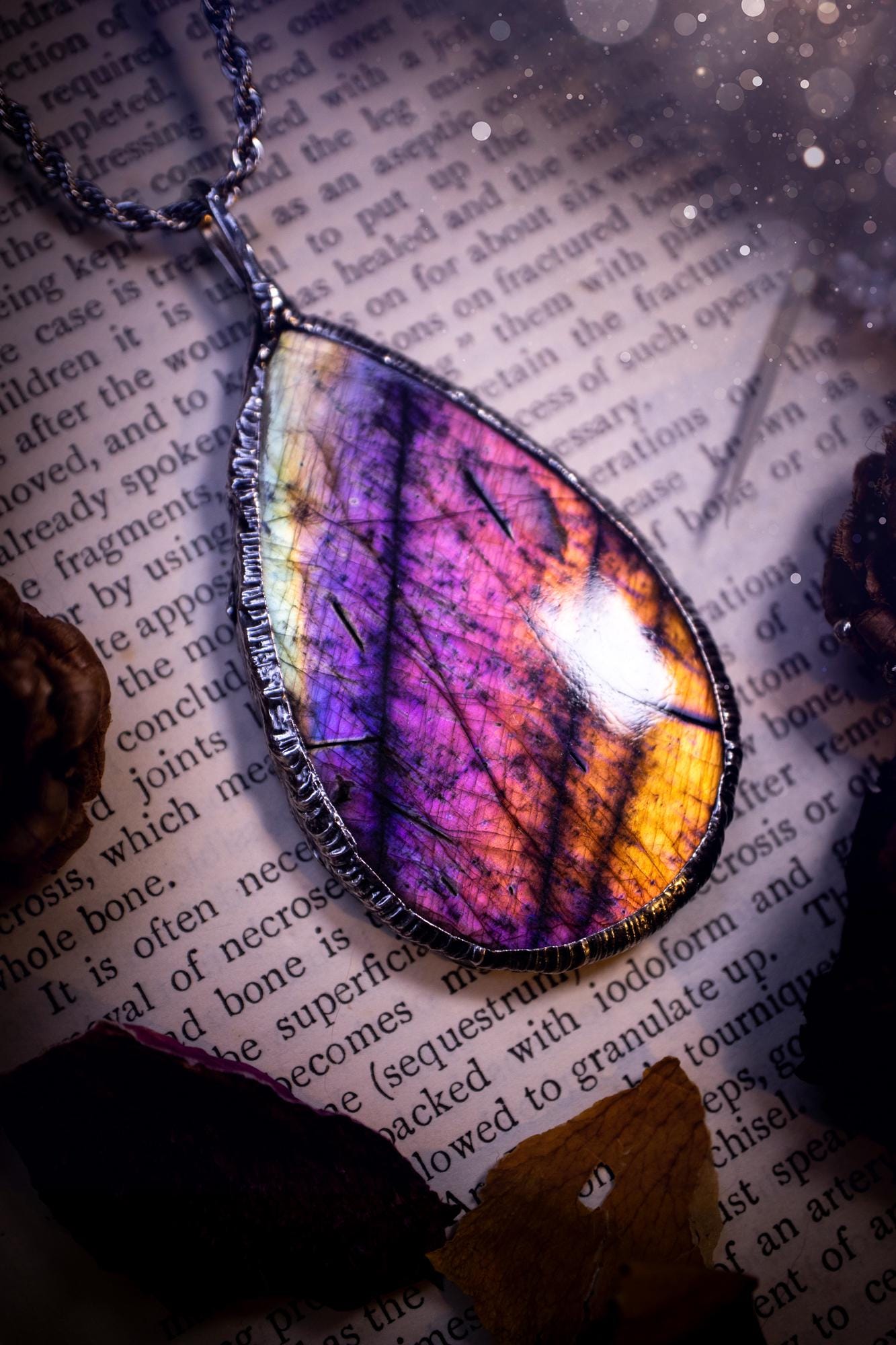 The ultimate labradorite soft soldered pendant necklace. This pendant necklace features the most beautiful and natural Labradorite spectrolite crystal that has so many hues of silver, purple, pink and orange. Handmade using the tiffany technique, also known as soft soldering. This piece is made from solder which contains metals and silver and is safe to wear. The ideal gift for any jewellery lover and crystal collector! Witchy, gothic and hippy jewellery that has been made for the soul.