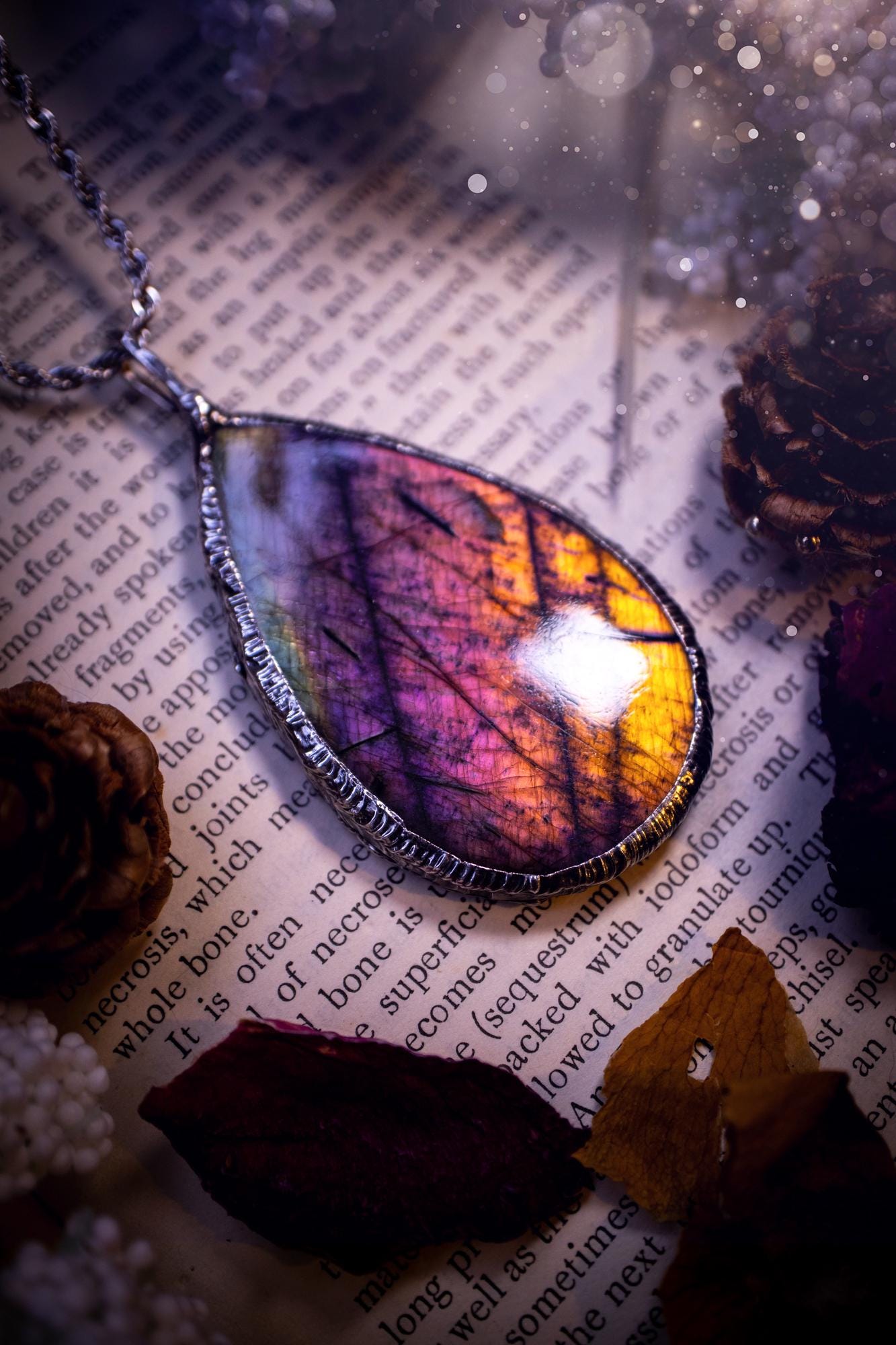 The ultimate labradorite soft soldered pendant necklace. This pendant necklace features the most beautiful and natural Labradorite spectrolite crystal that has so many hues of silver, purple, pink and orange. Handmade using the tiffany technique, also known as soft soldering. This piece is made from solder which contains metals and silver and is safe to wear. The ideal gift for any jewellery lover and crystal collector! Witchy, gothic and hippy jewellery that has been made for the soul.