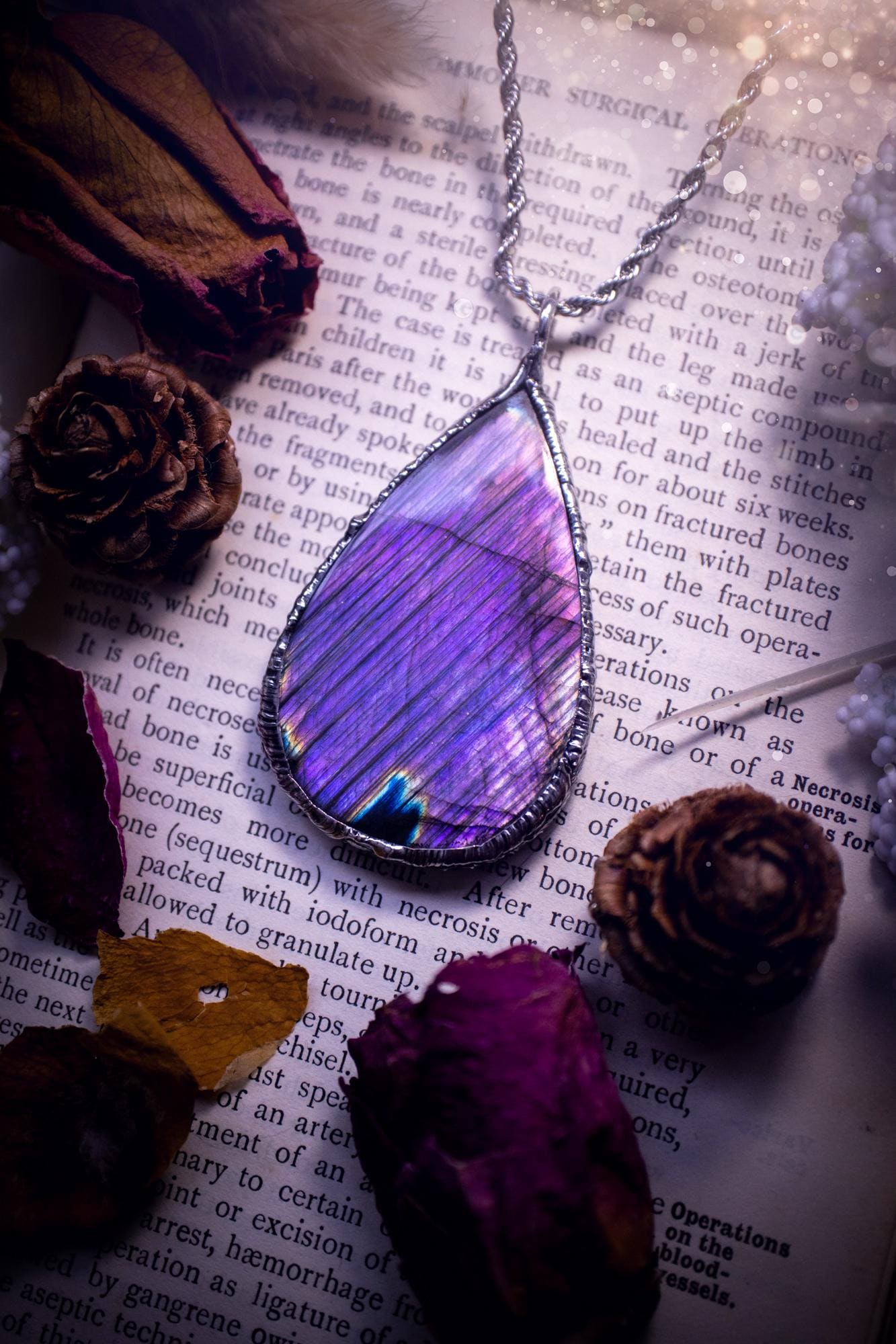 The ultimate labradorite soft soldered pendant necklace. This pendant necklace features the most beautiful and natural Labradorite spectrolite crystal that has so many hues of blue and purple, with stripes. Handmade using the tiffany technique, also known as soft soldering. This piece is made from solder which contains metals and silver and is safe to wear. The ideal gift for any jewellery lover and crystal collector! Witchy, gothic and hippy jewellery that has been made for the soul.