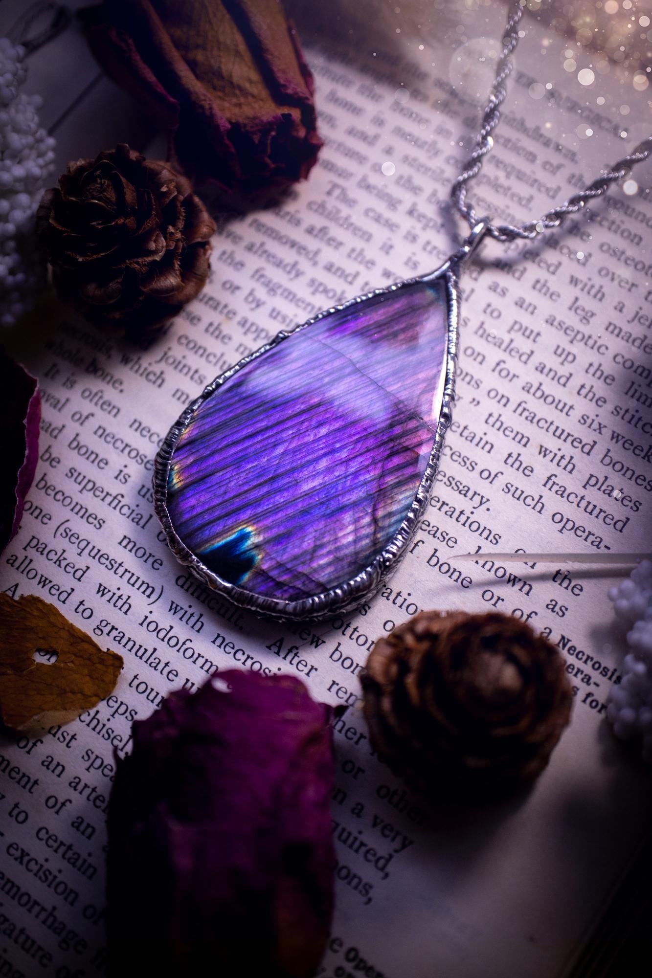 The ultimate labradorite soft soldered pendant necklace. This pendant necklace features the most beautiful and natural Labradorite spectrolite crystal that has so many hues of blue and purple, with stripes. Handmade using the tiffany technique, also known as soft soldering. This piece is made from solder which contains metals and silver and is safe to wear. The ideal gift for any jewellery lover and crystal collector! Witchy, gothic and hippy jewellery that has been made for the soul.