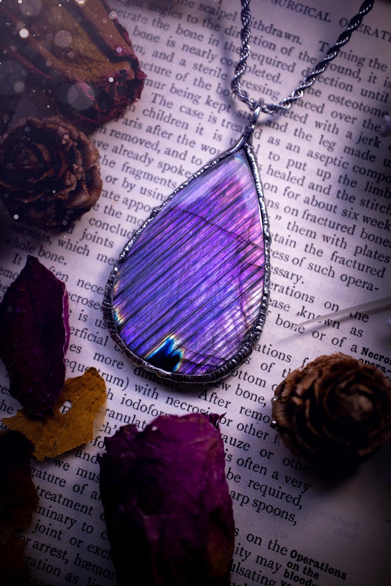 The ultimate labradorite soft soldered pendant necklace. This pendant necklace features the most beautiful and natural Labradorite spectrolite crystal that has so many hues of blue and purple, with stripes. Handmade using the tiffany technique, also known as soft soldering. This piece is made from solder which contains metals and silver and is safe to wear. The ideal gift for any jewellery lover and crystal collector! Witchy, gothic and hippy jewellery that has been made for the soul.
