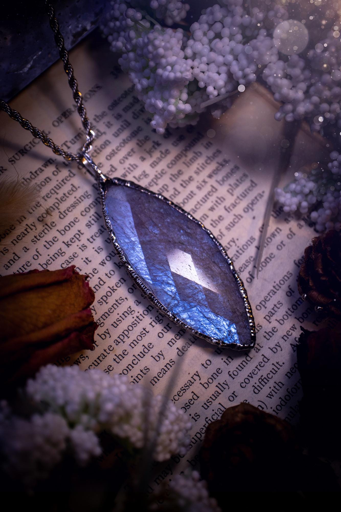 Handmade and beautiful, rose cut, belomorite, soft soldered pendant necklace. This pendant necklace features the most gorgeous and flashy belomorite moonstone crystal, full of glittery shimmer and a deep lovely blue hue. Handcrafted using the soft solder method, also known as the tiffany technique, an ancient technique used to created stained glass windows. The solder used is lead free and totally safe to wear, it contains elements of silver and polishes up to a high lustre. Gothic jewellery