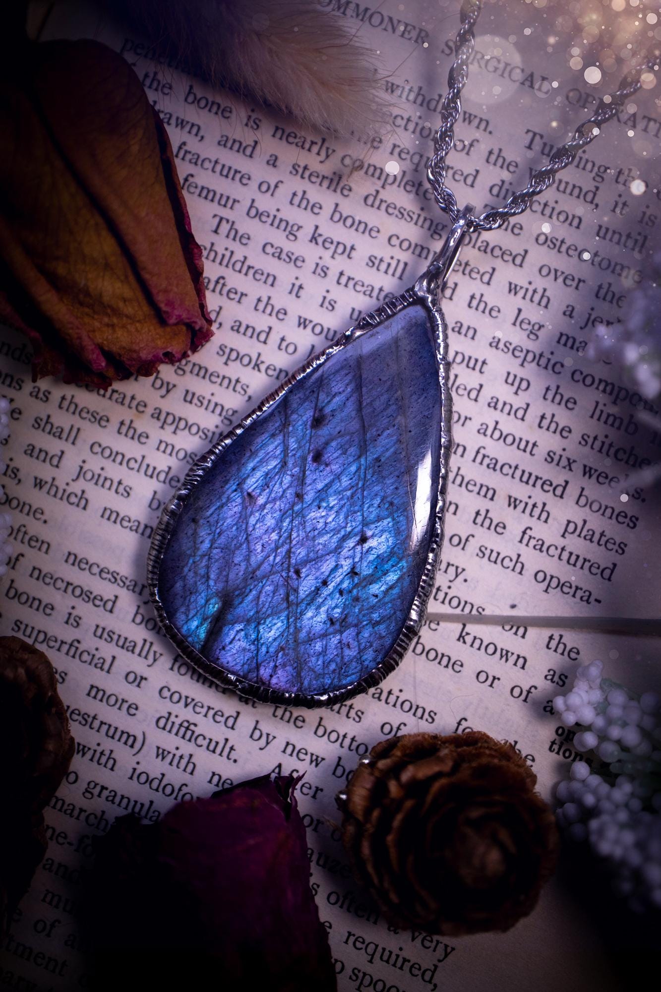 The ultimate labradorite soft soldered pendant necklace. This pendant necklace features the most beautiful and natural Labradorite spectrolite crystal that has so many hues of pastel blue and purples. Handmade using the tiffany technique, also known as soft soldering. This piece is made from solder which contains metals and silver and is safe to wear. The ideal gift for any jewellery lover and crystal collector! Witchy, gothic and hippy jewellery that has been made for the soul.