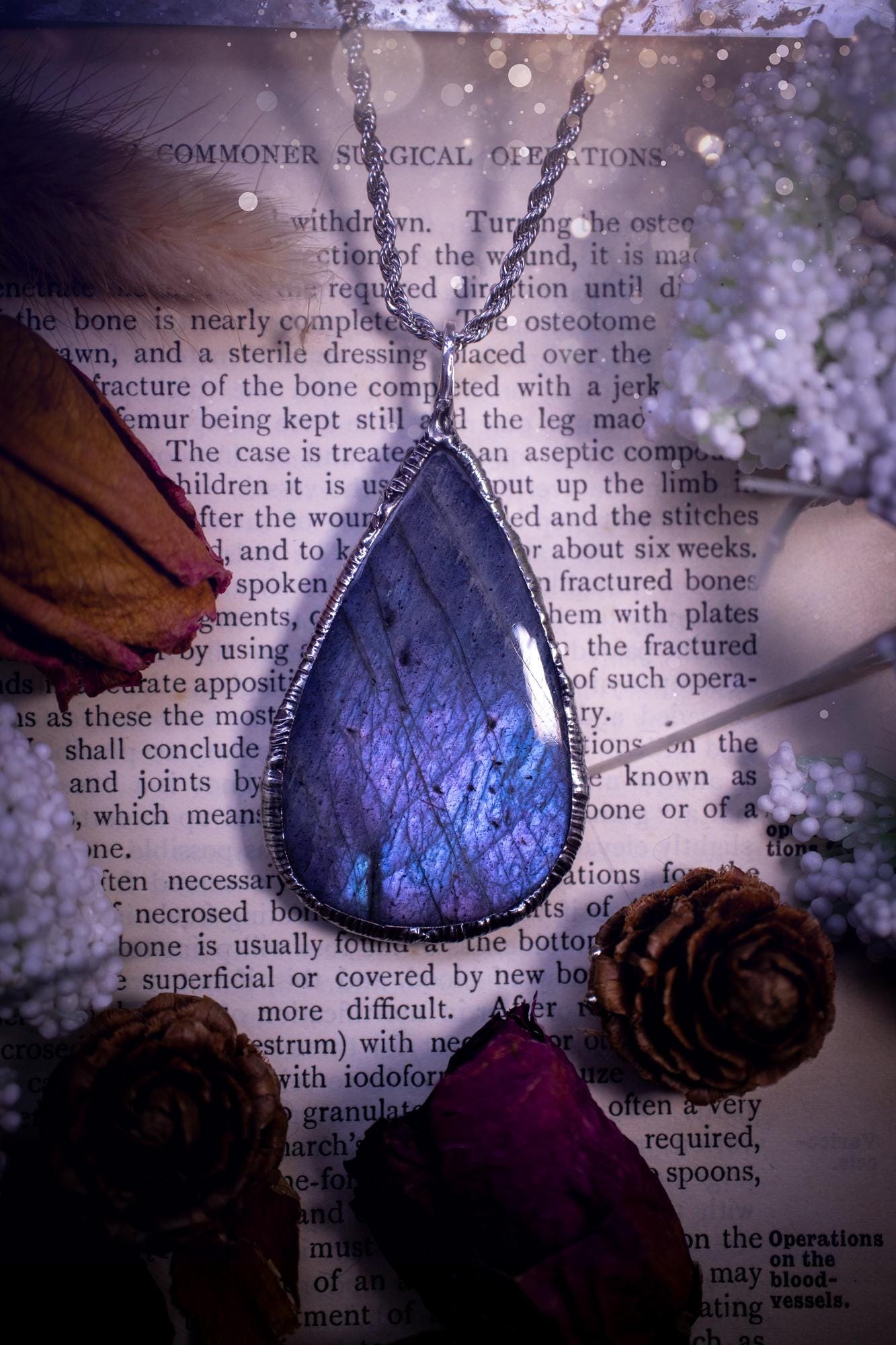 The ultimate labradorite soft soldered pendant necklace. This pendant necklace features the most beautiful and natural Labradorite spectrolite crystal that has so many hues of pastel blue and purples. Handmade using the tiffany technique, also known as soft soldering. This piece is made from solder which contains metals and silver and is safe to wear. The ideal gift for any jewellery lover and crystal collector! Witchy, gothic and hippy jewellery that has been made for the soul.