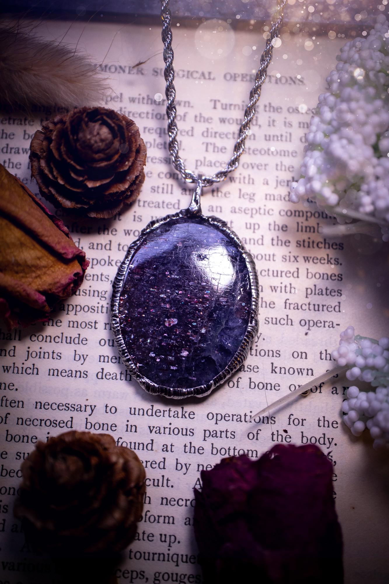 Beautiful and very unique, iolite sunstone crystal, soft soldered pendant necklace. This pendant feature the most sparkly iolite sunstone crystal and is full of purple hues with shimmer! Handmade using the tiffany technique, also known as soft soldering. This piece is made from solder which contains metals and silver and is safe to wear. The ideal gift for any jewellery lover and crystal collector! Witchy, gothic and hippy jewellery that has been made for the soul.