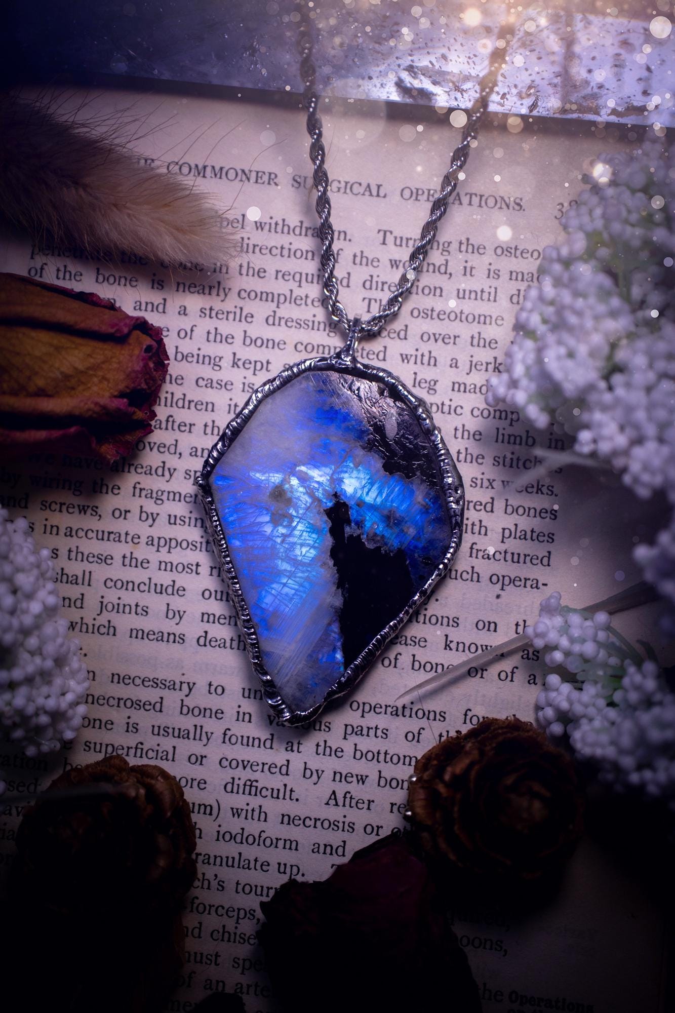 Handmade and beautiful, rainbow moonstone slab, soft soldered pendant necklace. This pendant necklace features the most gorgeous and flashy rainbow moonstone slab crystal, full of glittery shimmer and a deep lovely blue hue. Handcrafted using the soft solder method, also known as the tiffany technique, an ancient technique used to created stained glass windows. The solder used is lead free and totally safe to wear, it contains elements of silver and polishes up to a high lustre. Gothic jewellery